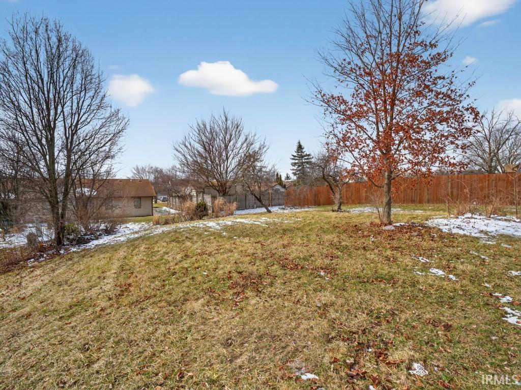 View of yard covered in snow
