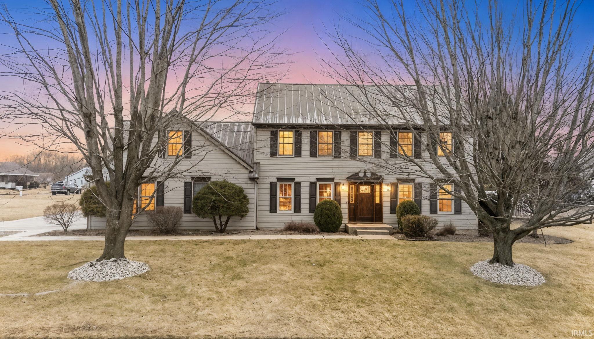 Colonial inspired home with a front yard