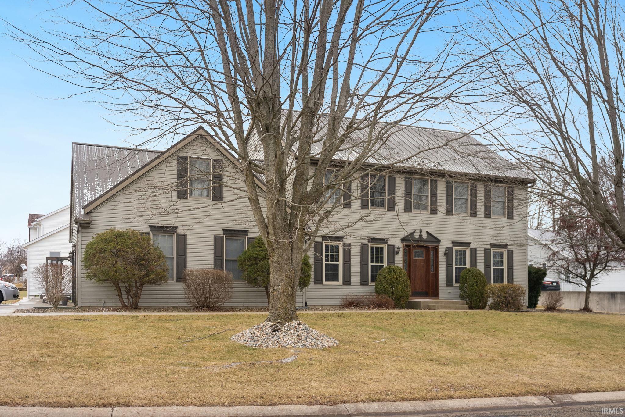 Colonial home with a front lawn