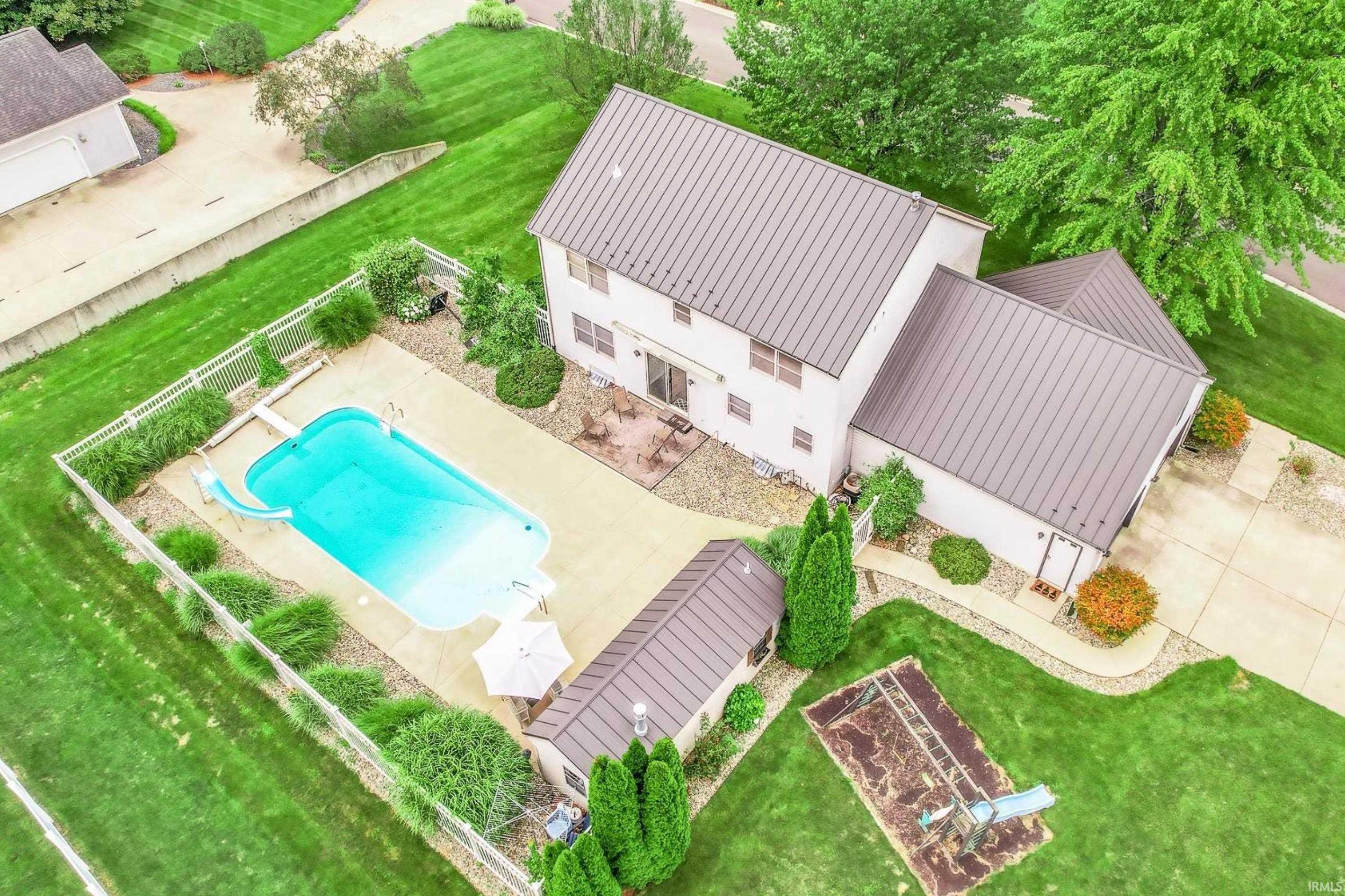 View of subject property featuring a pool area