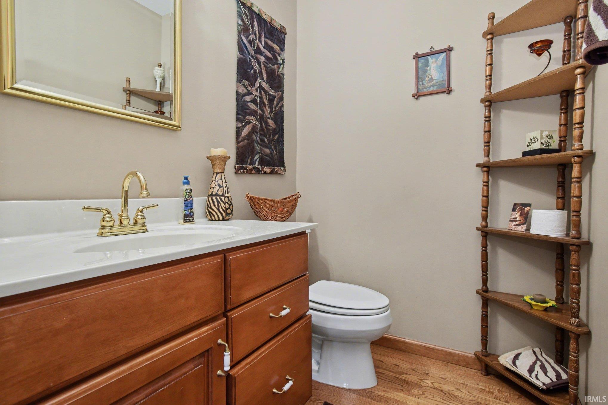 Bathroom with vanity and light wood-style floors