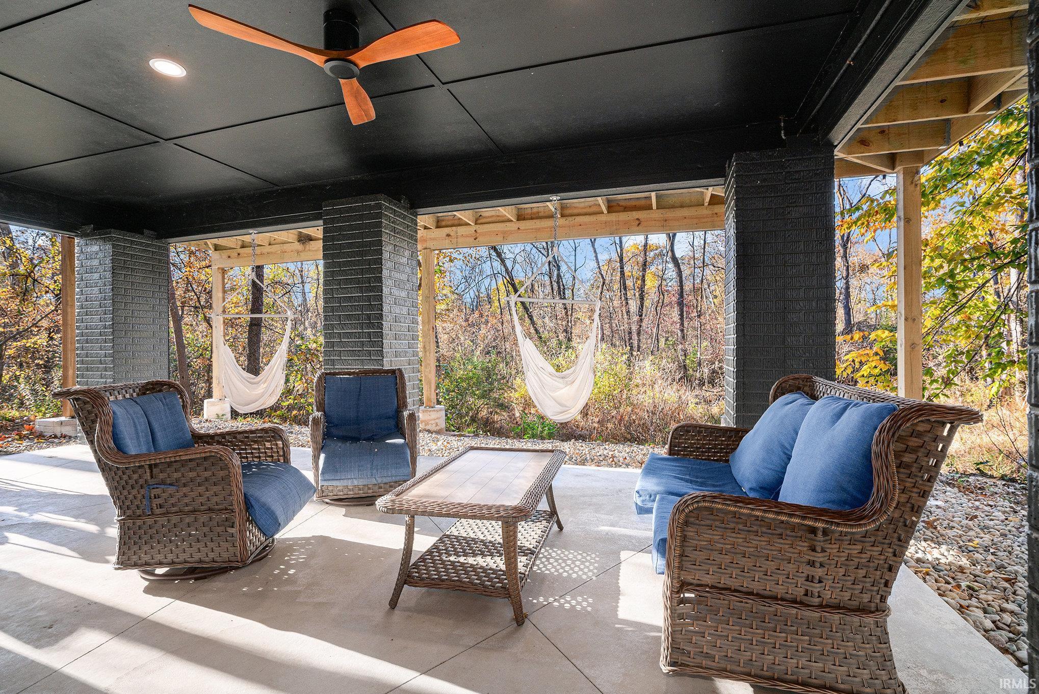 View of patio featuring ceiling fan and outdoor seating