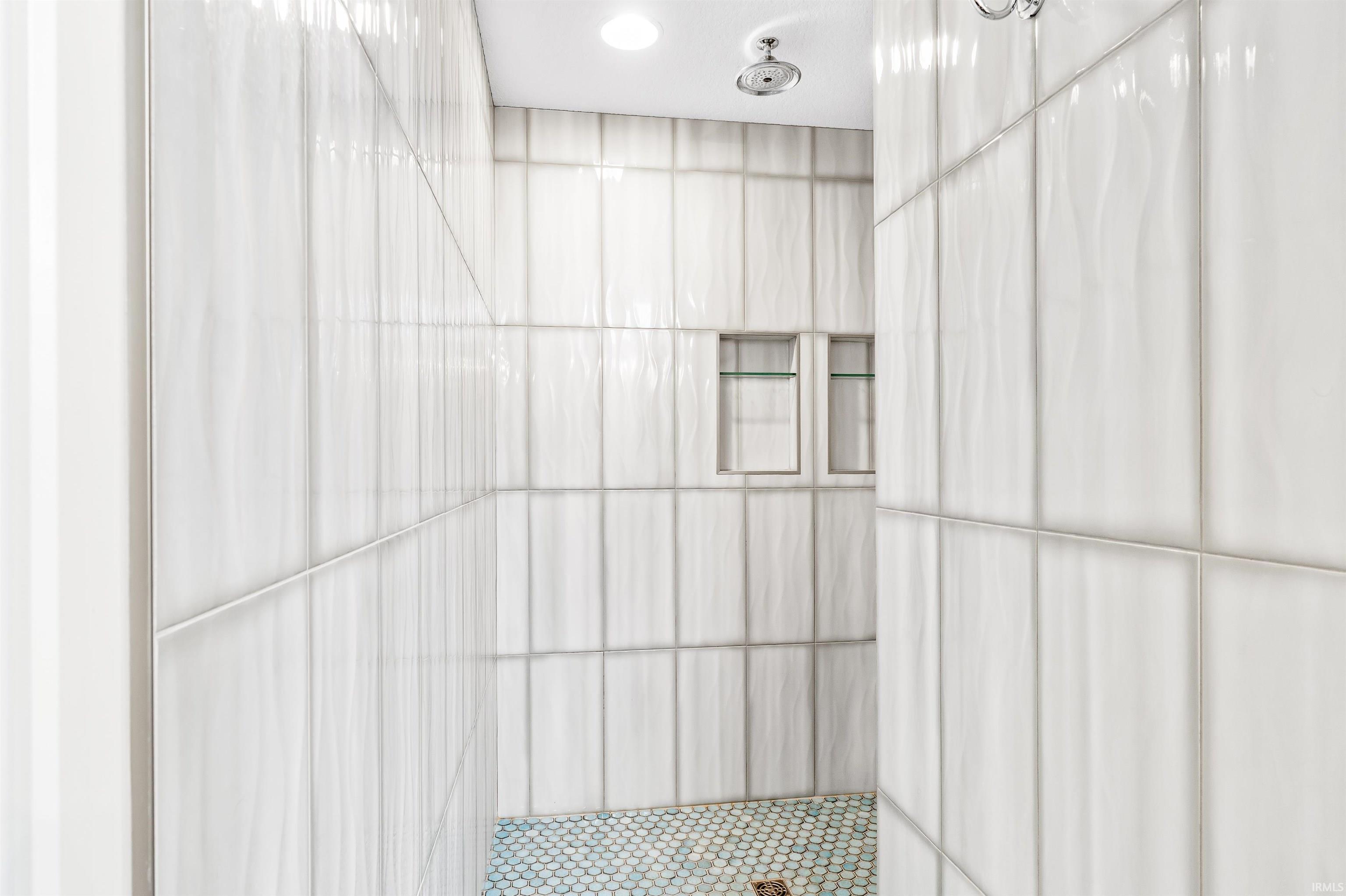 Full bathroom with a tile shower