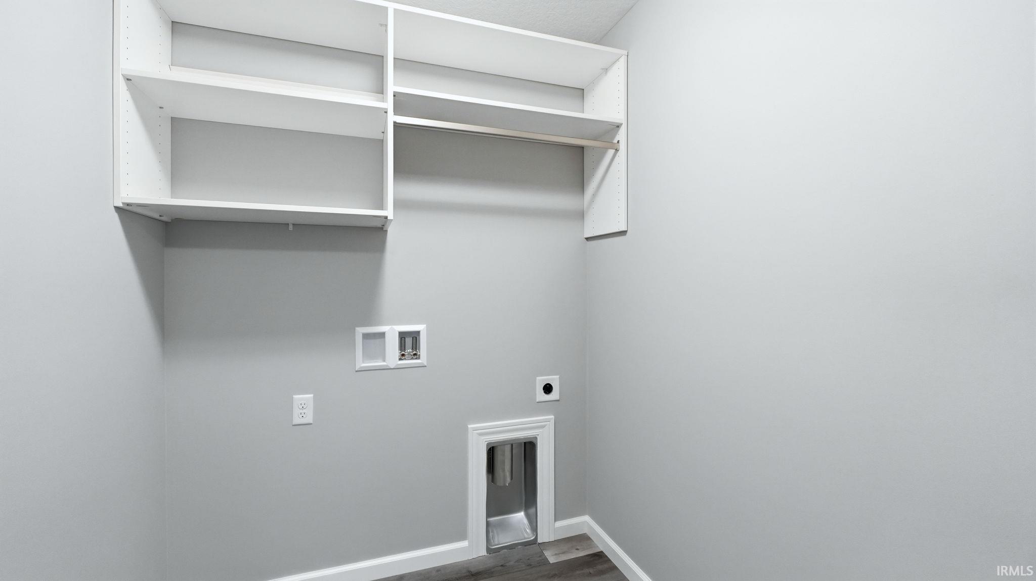Laundry area featuring dark wood-style flooring, hookup for a washing machine, and electric dryer hookup