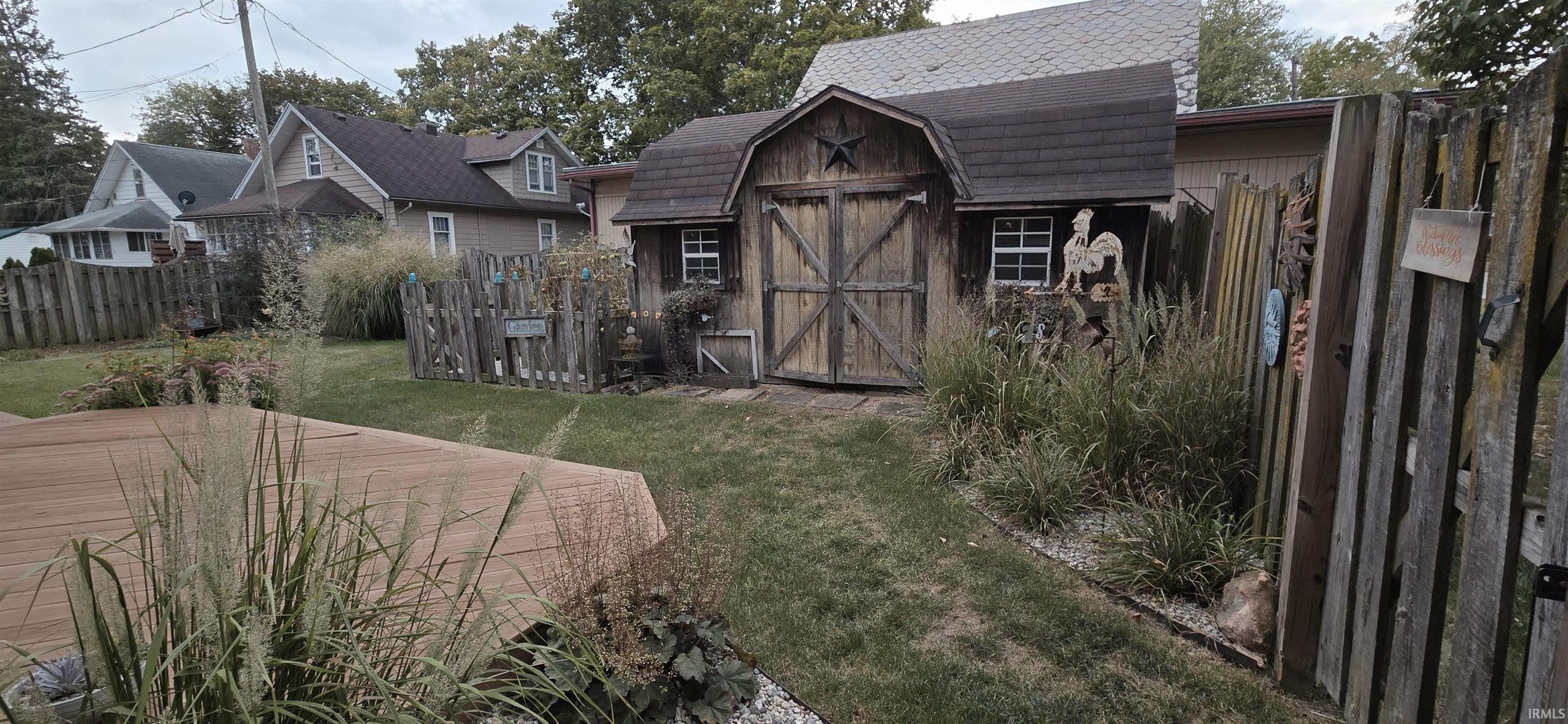 View of shed with a fenced backyard