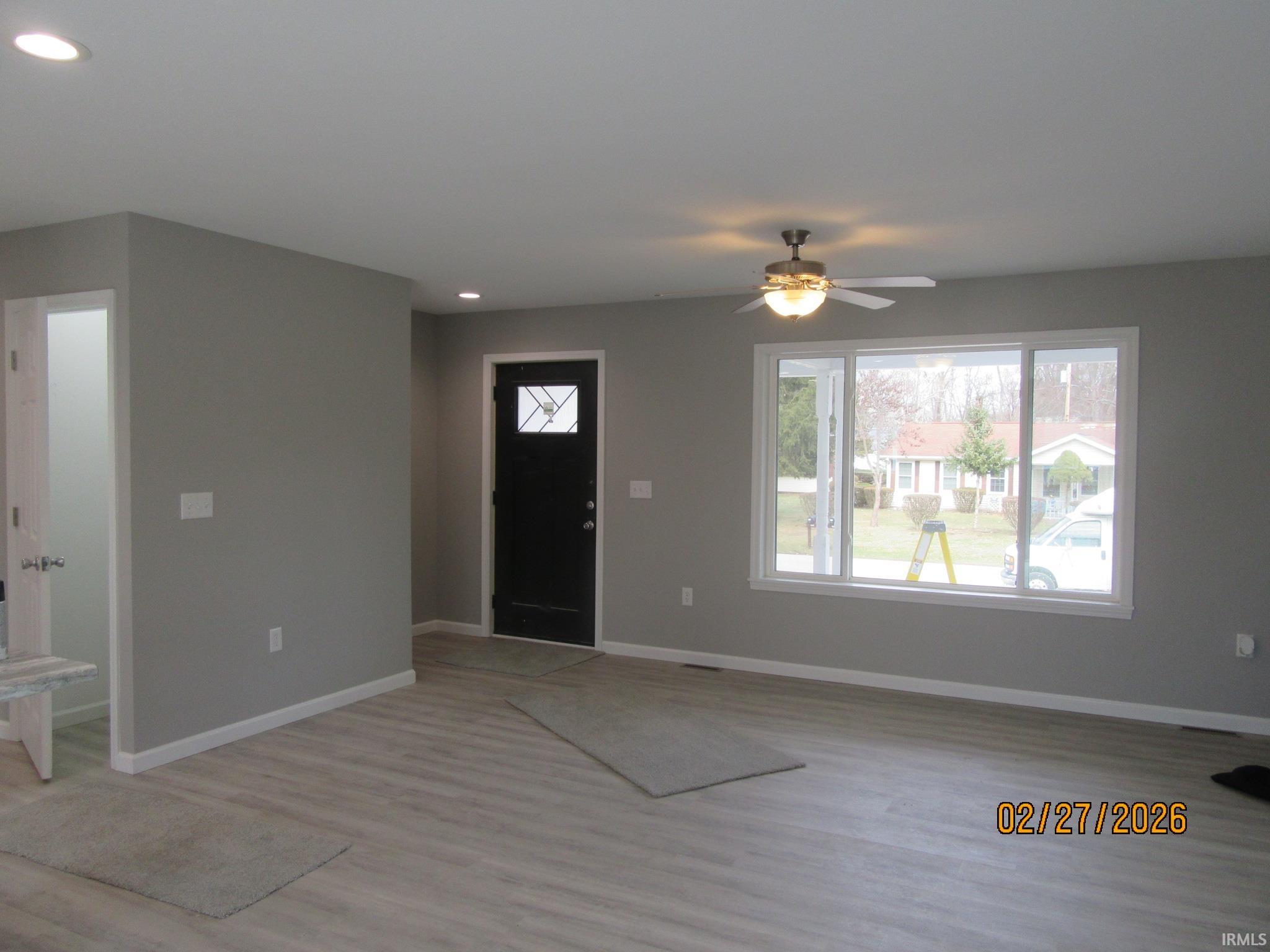 Entryway with ceiling fan, light wood-style flooring, and recessed lighting