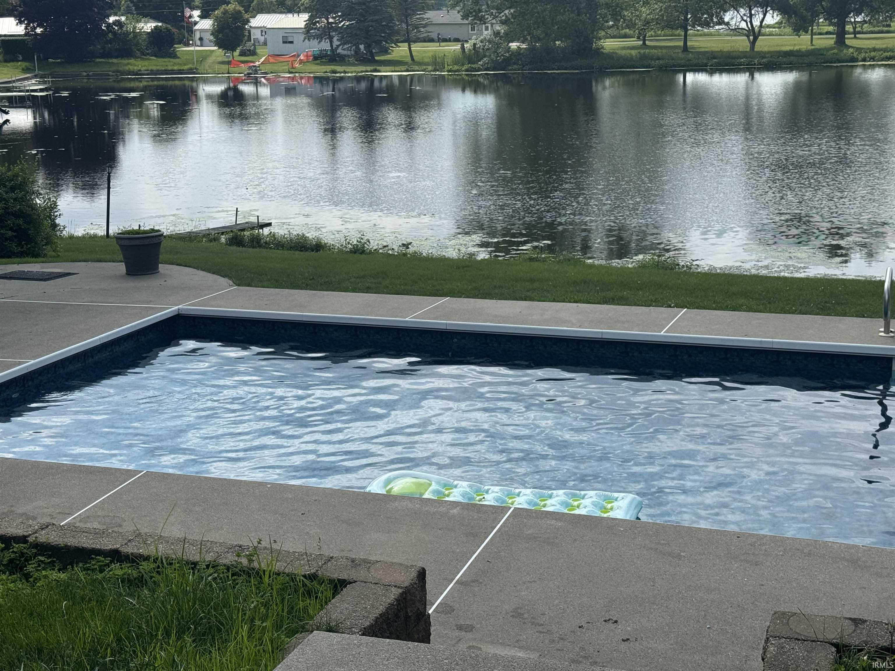 Swimming pool featuring a water view