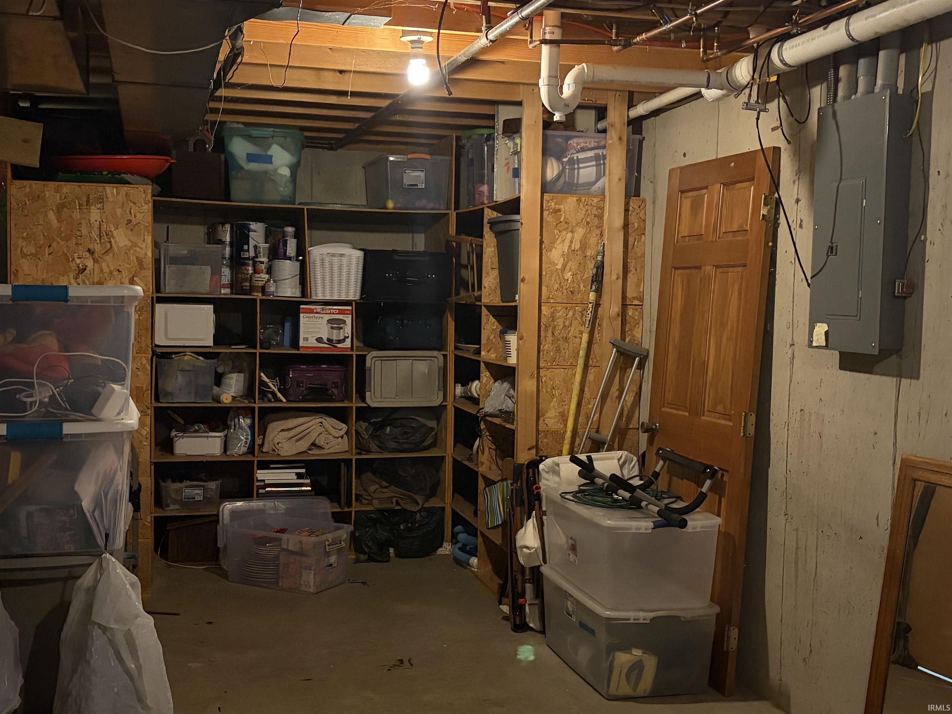 Storage area featuring electric panel