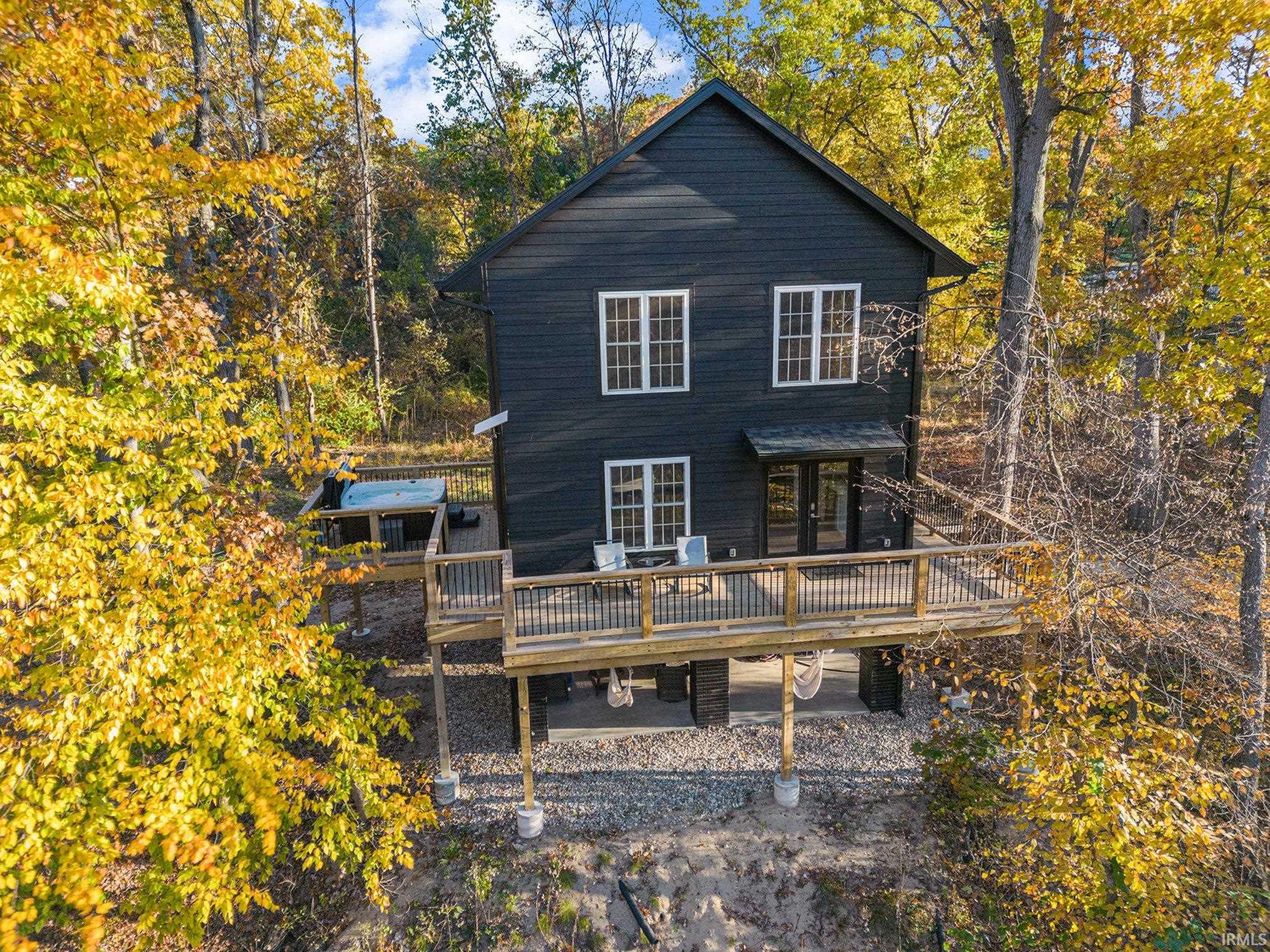 Back of property with a deck