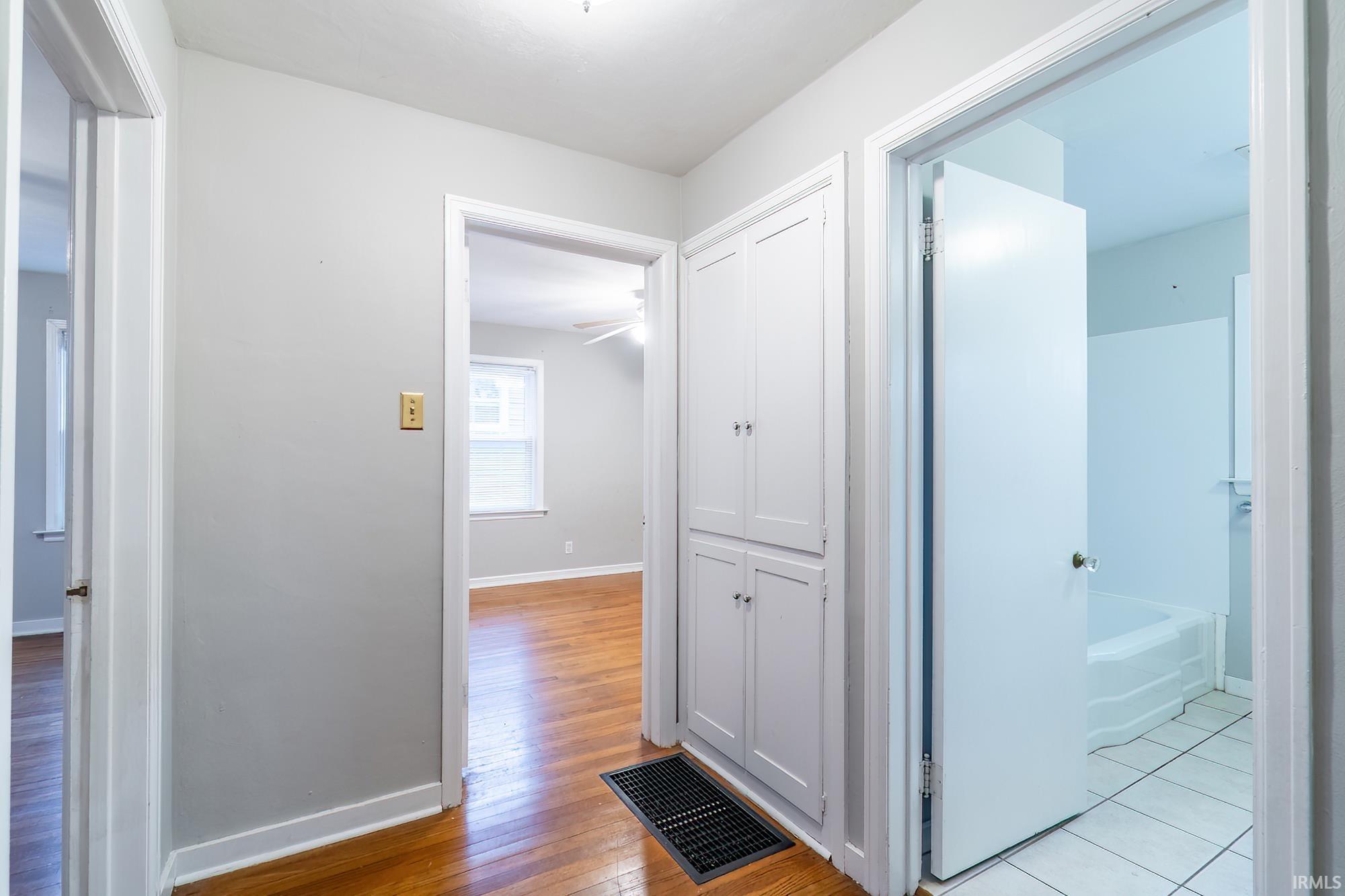 Hall featuring baseboards and light wood-style floors