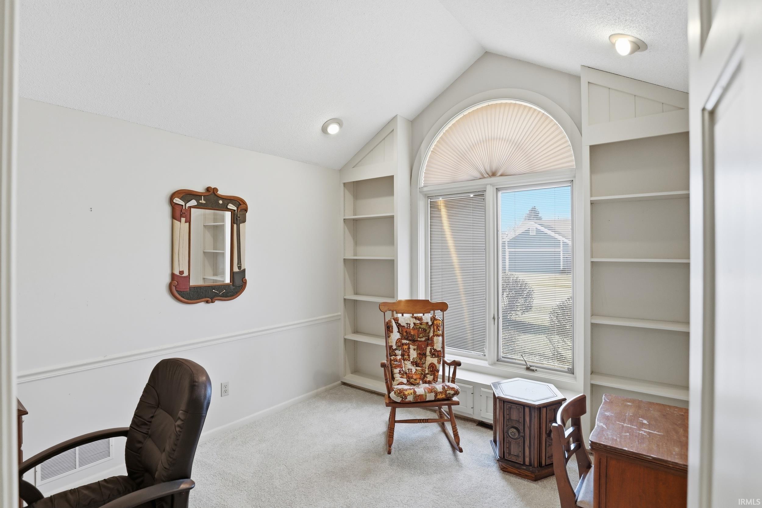 Office with built in features and light carpet