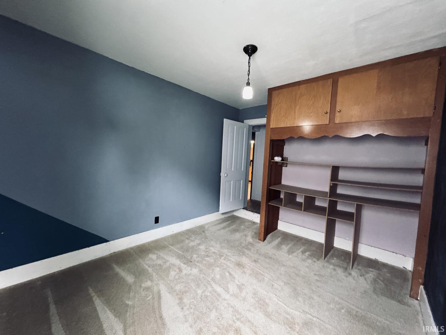 A lot of uses for this room. Full bath is through the door shown.