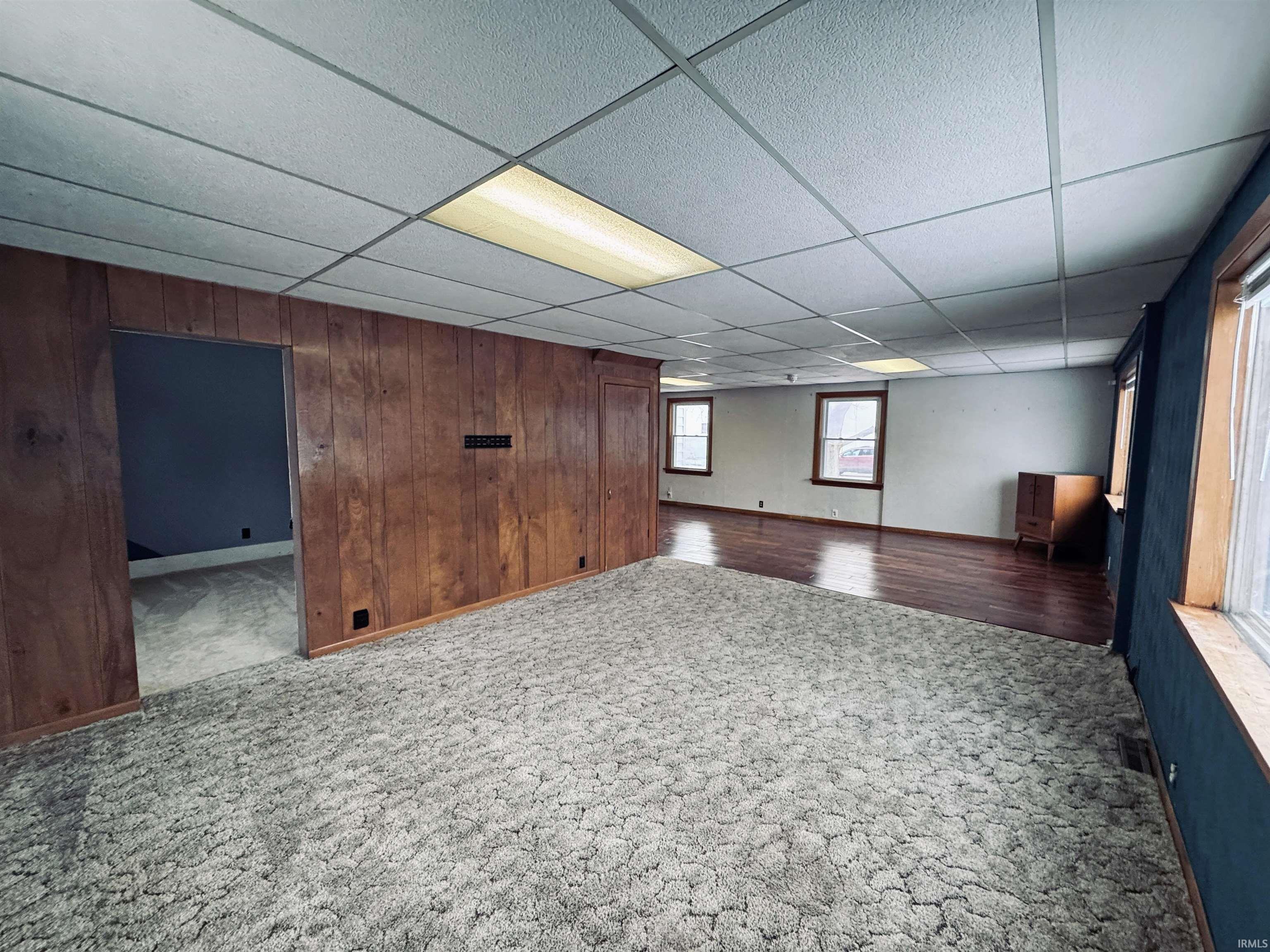 Main floor bedroom of office through the doorway to the left.