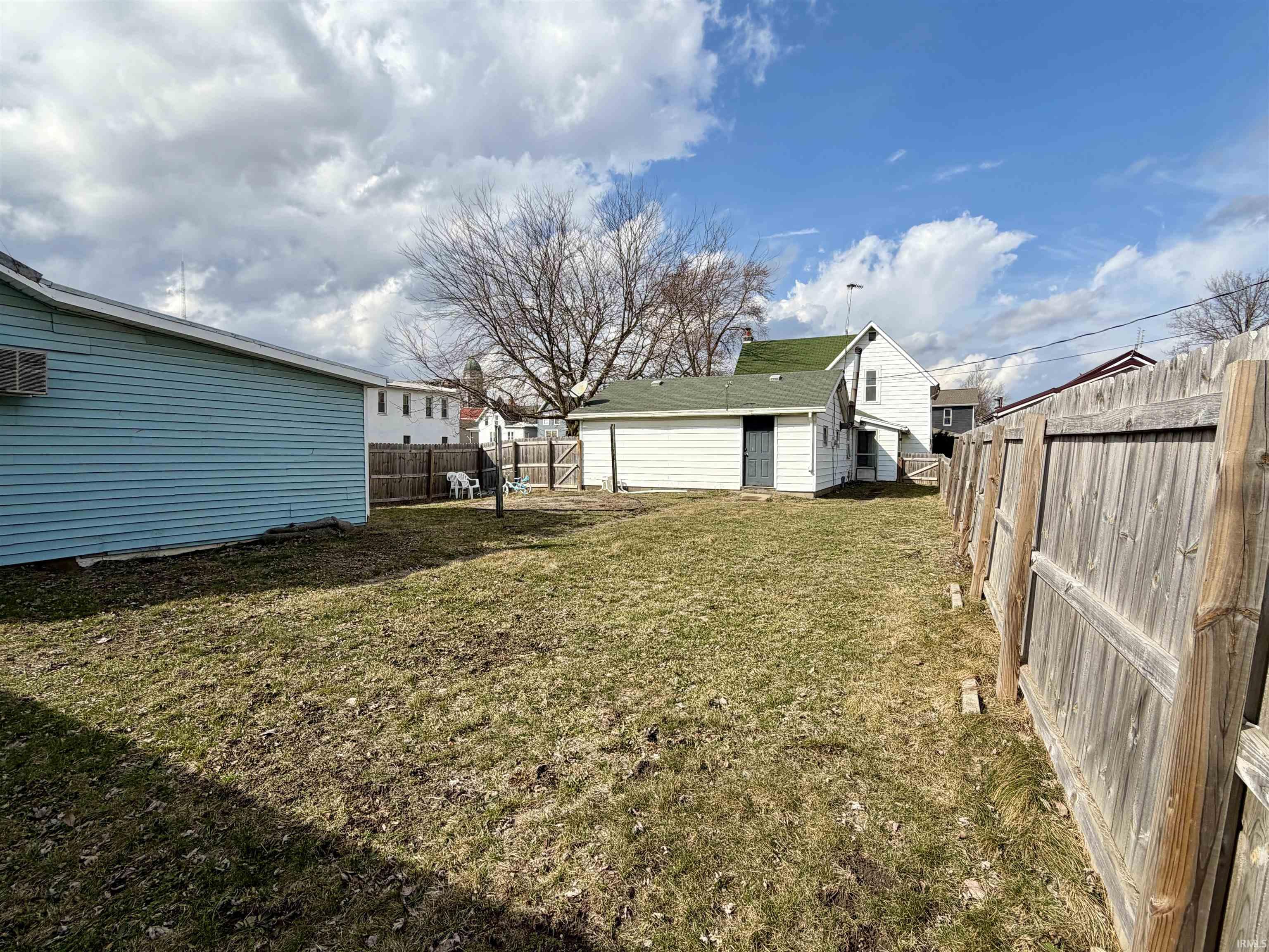 View of fenced backyard