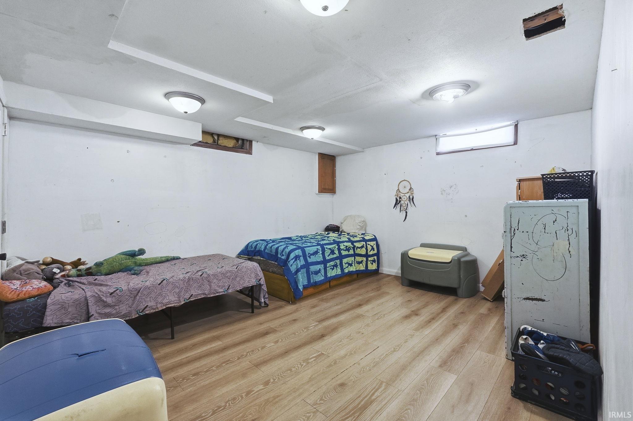 Bedroom featuring light wood-style flooring