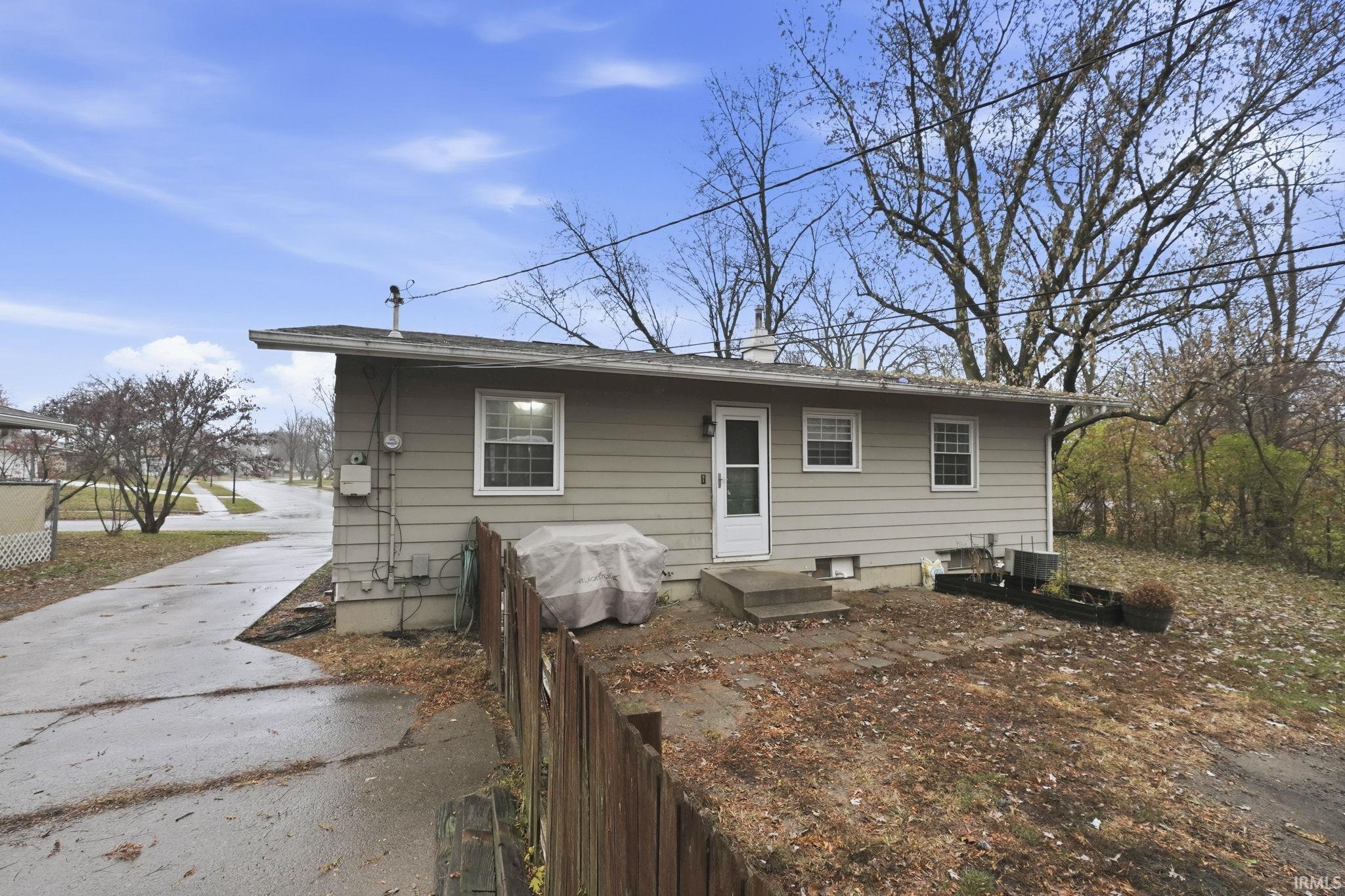 Back of property with a chimney