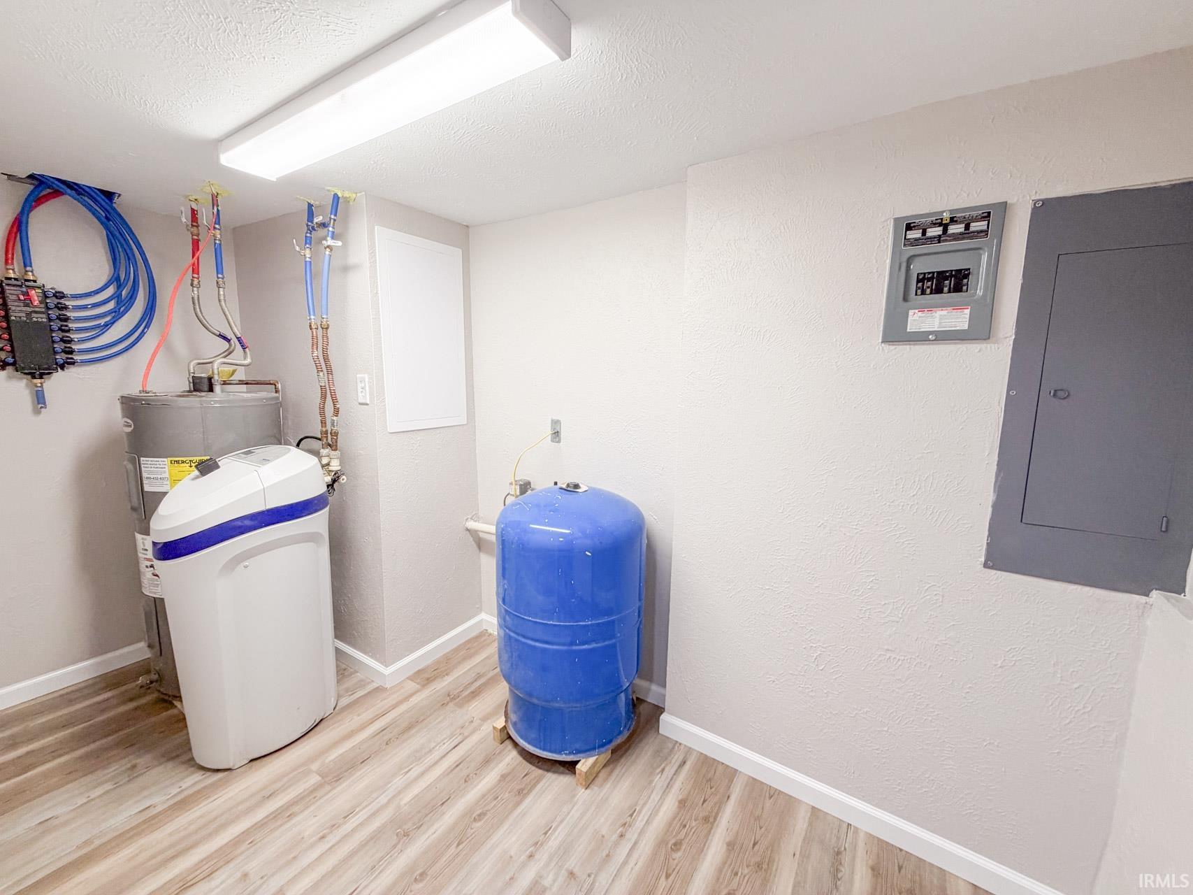 Utilities featuring electric panel and water heater