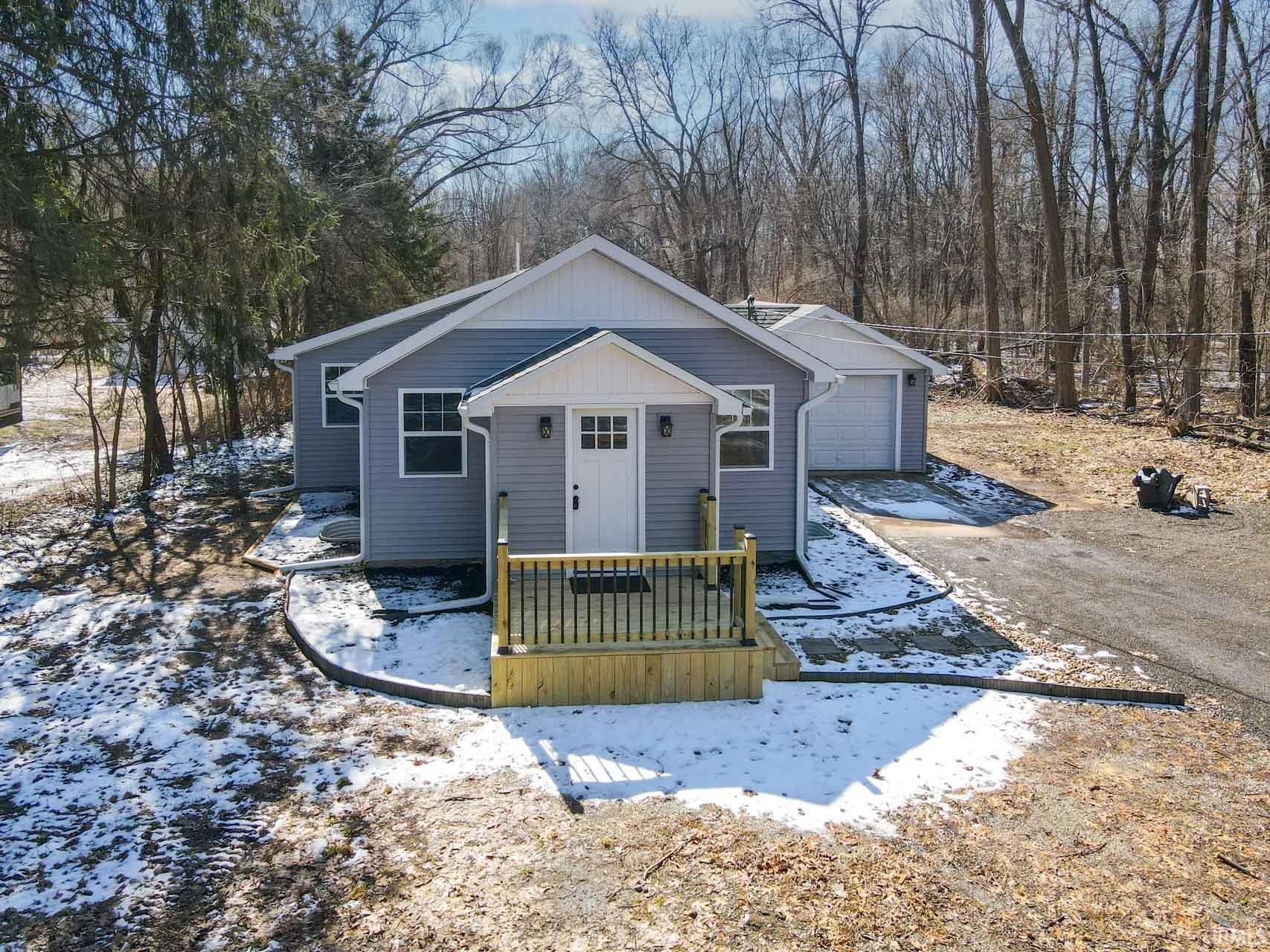 Bungalow-style home with driveway and a garage