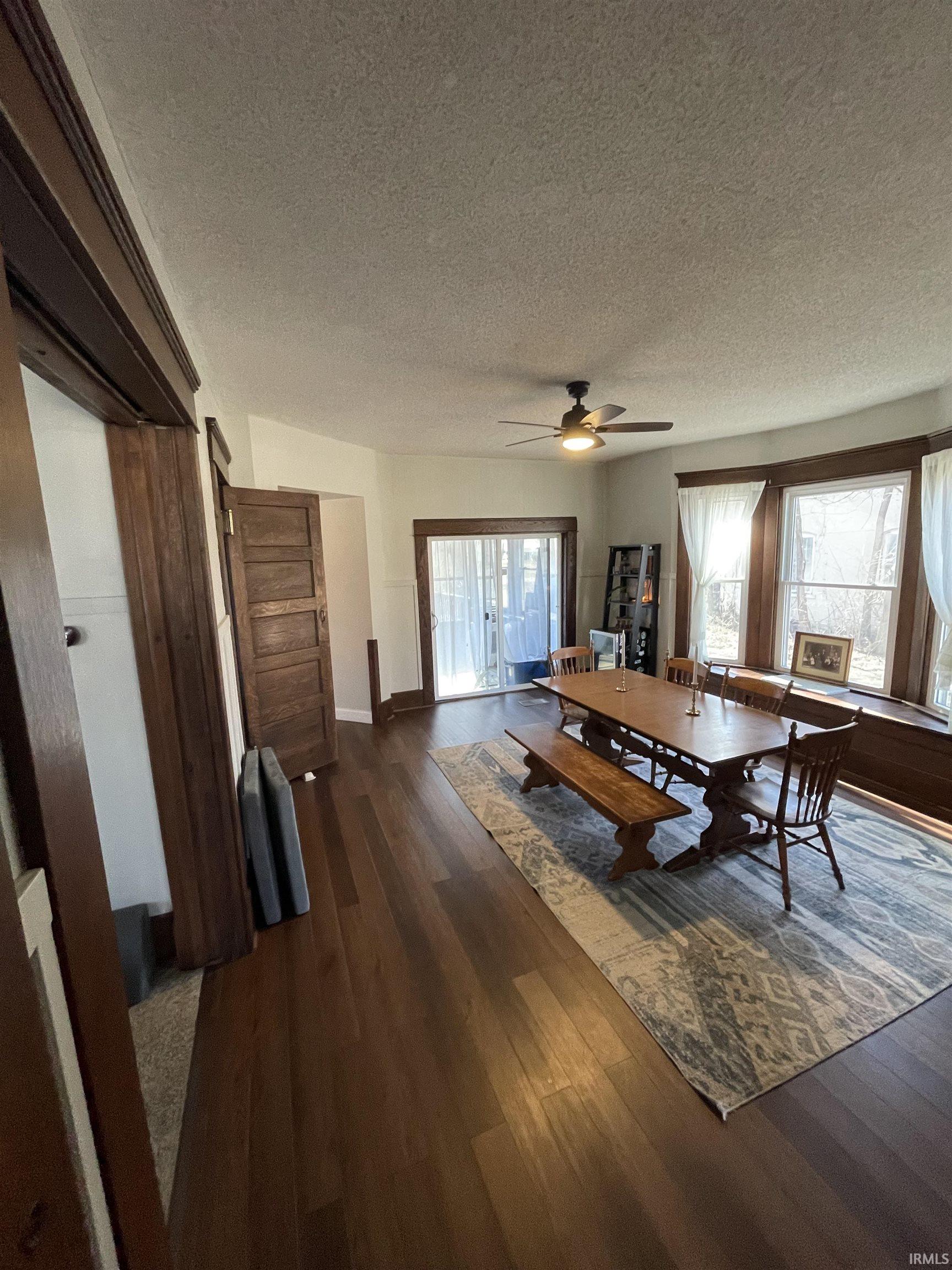 Open dining space featuring new flooring.
