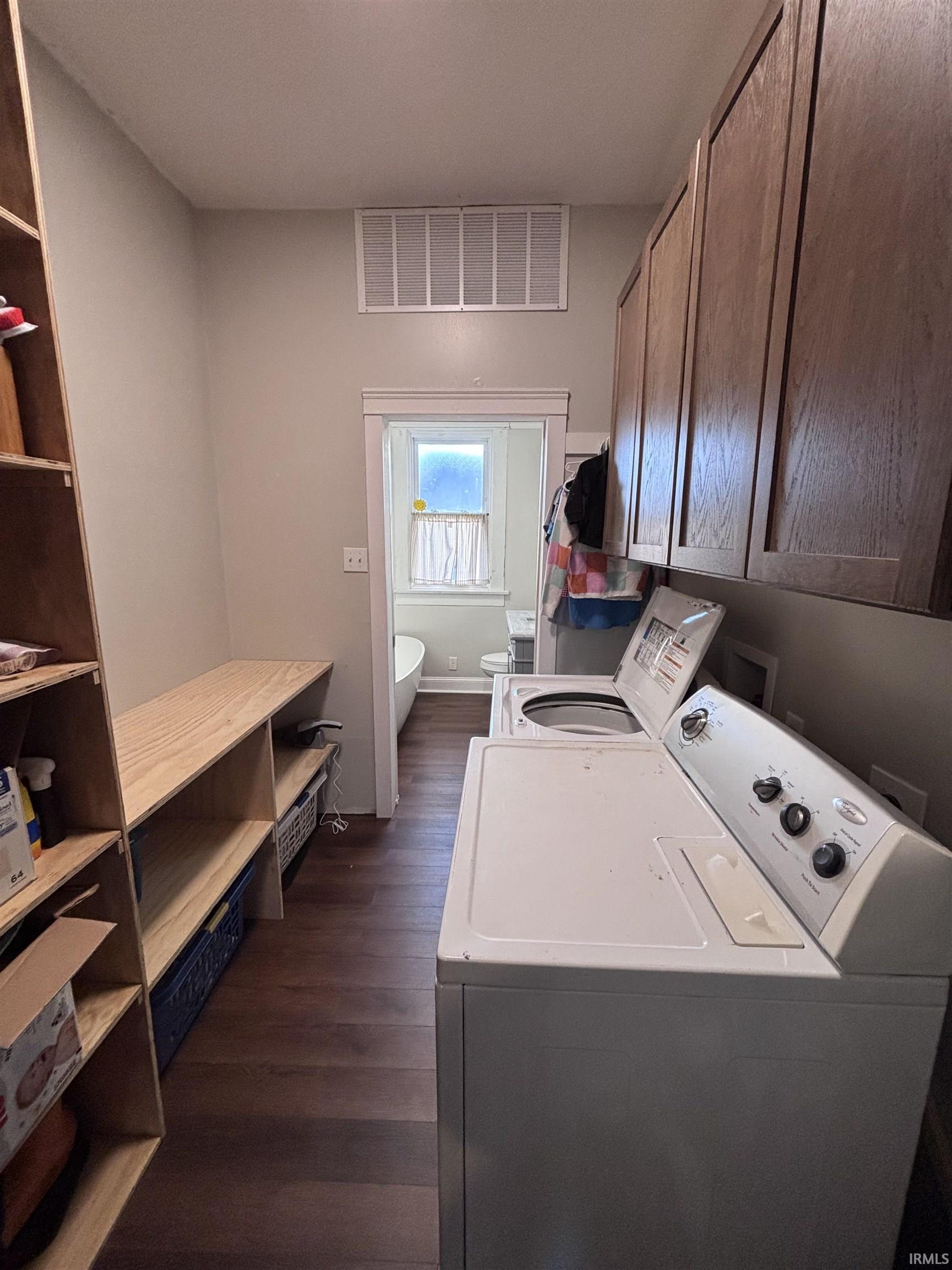 Laundry room with brand new flooring.