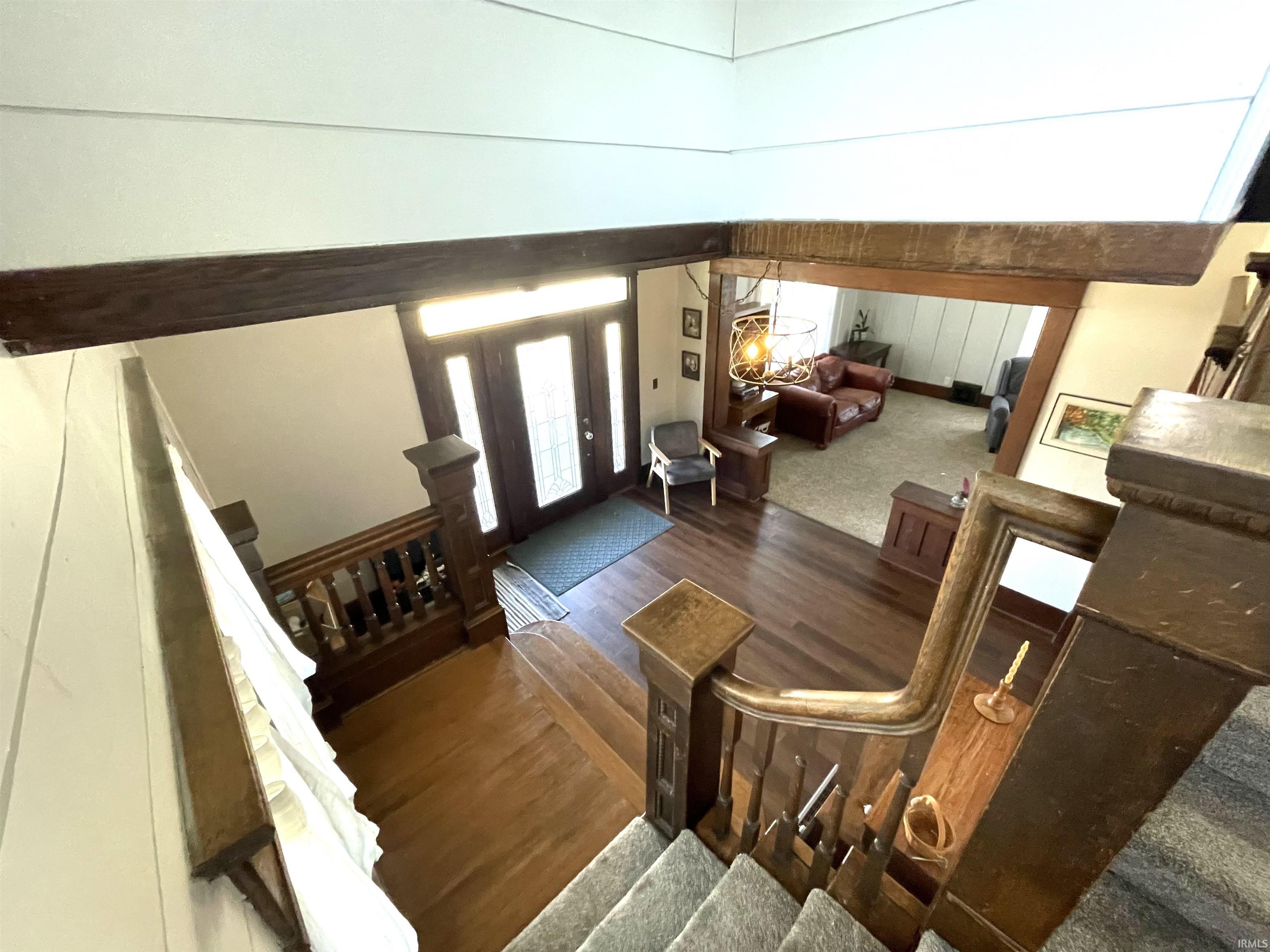 Entrance foyer with stairway and updated floors