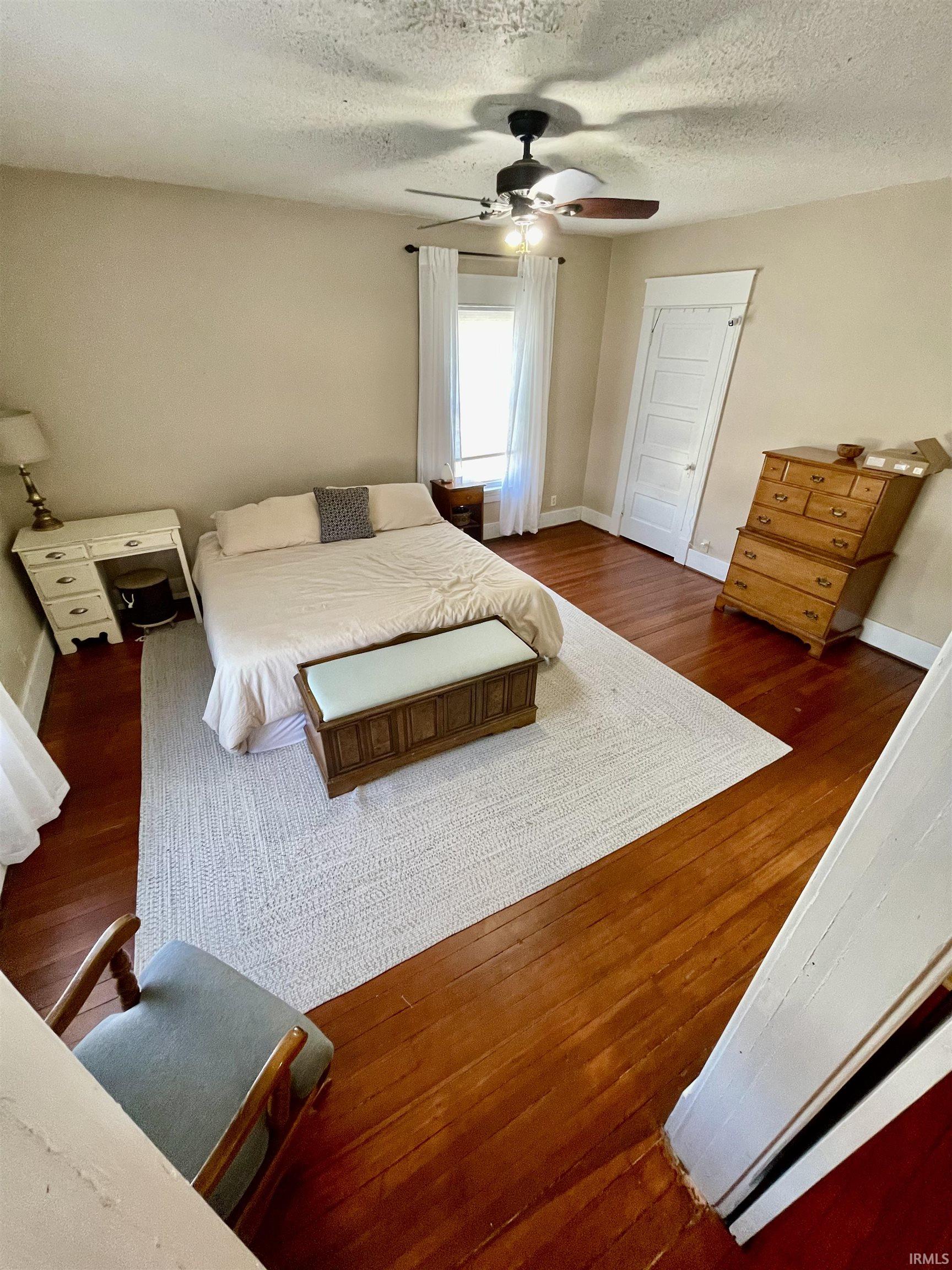 Bedroom with original wood flooring