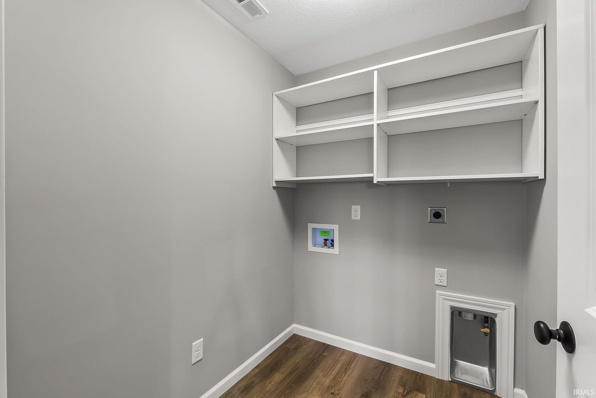 Laundry room featuring hookup for an electric dryer, washer hookup, and dark wood finished floors