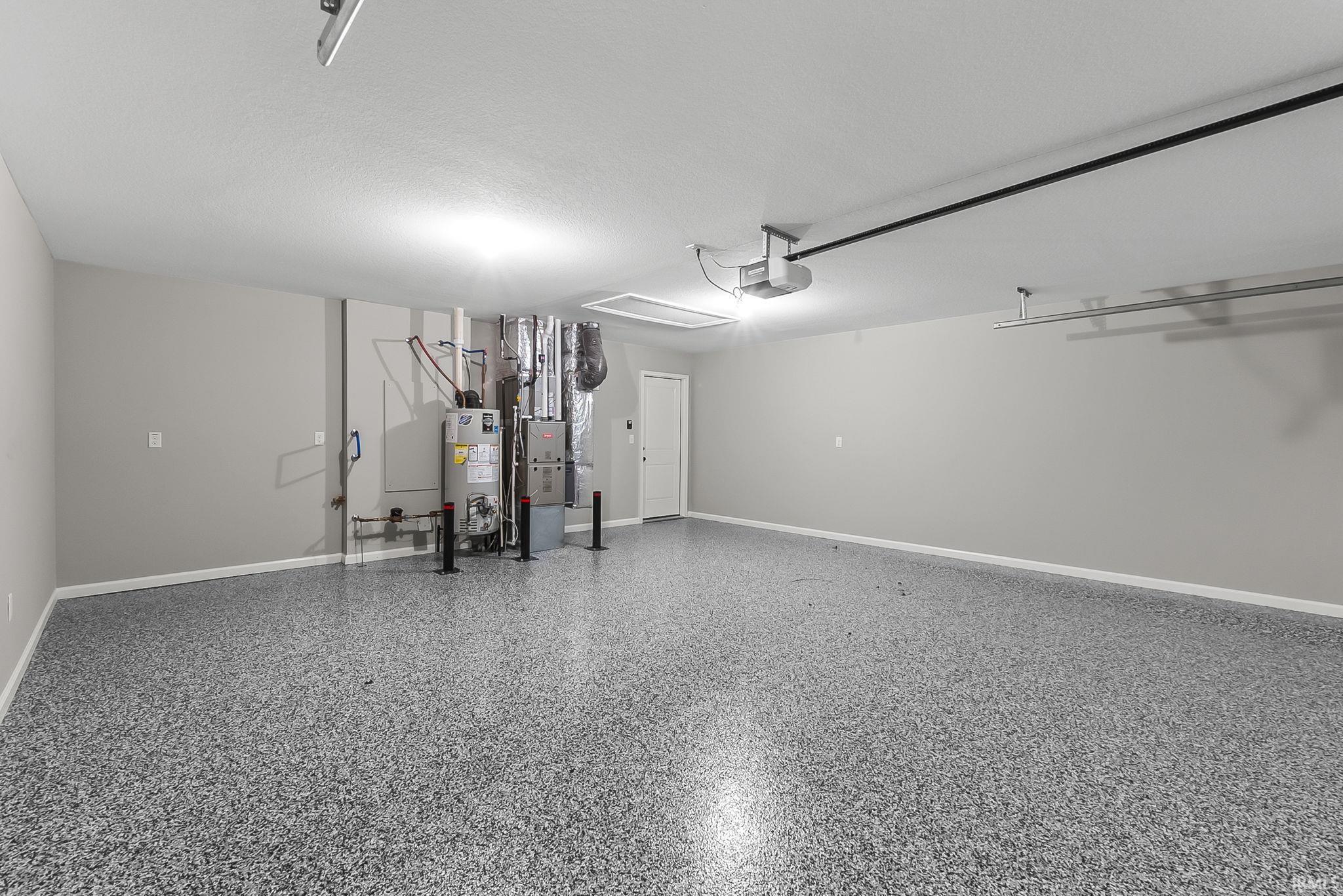 Garage with gas water heater and heating unit