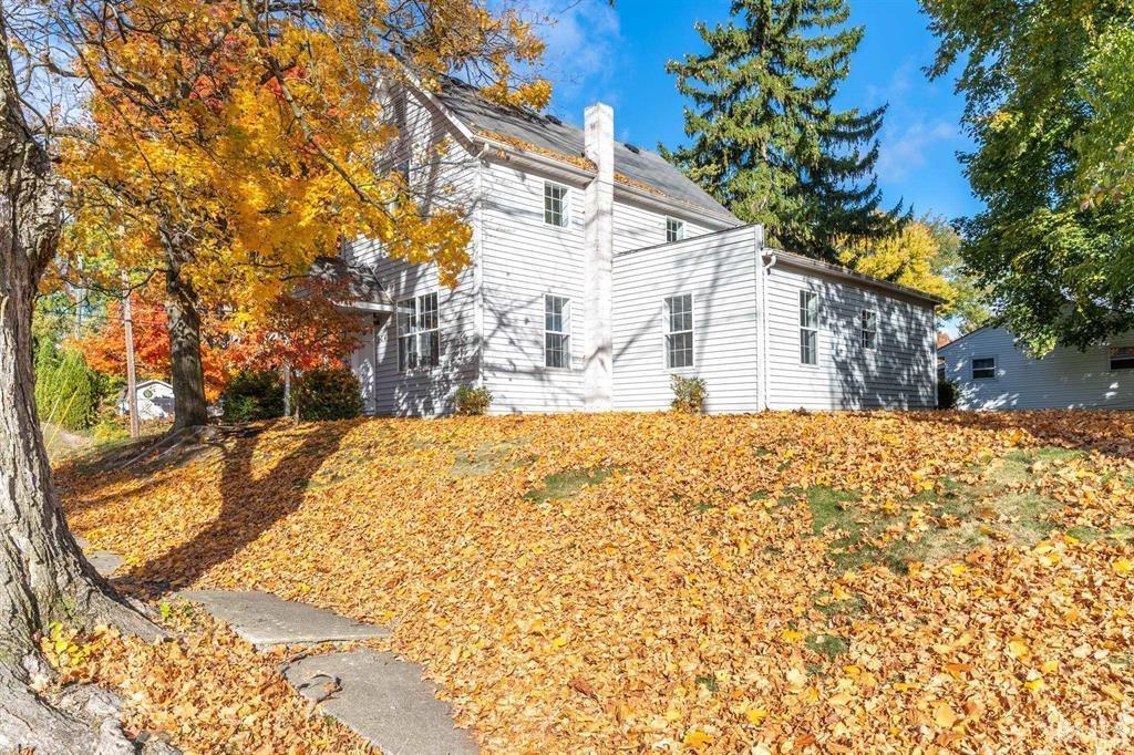 View of home's exterior with a chimney