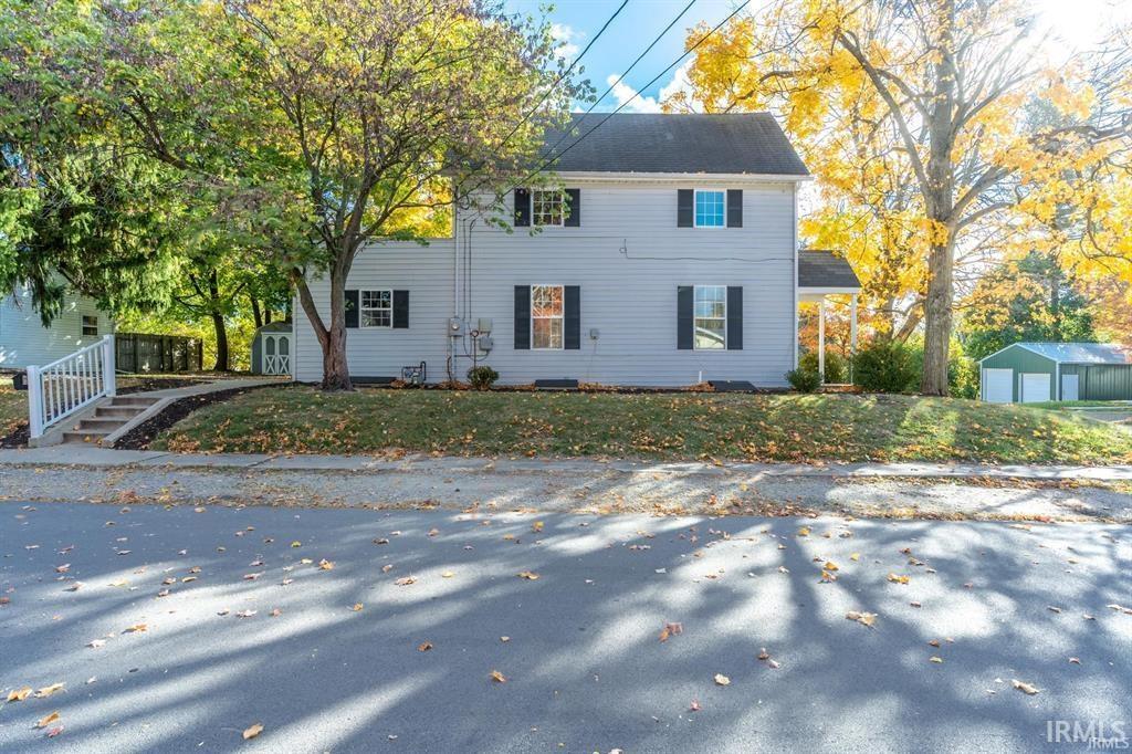 View of front of property featuring an outbuilding