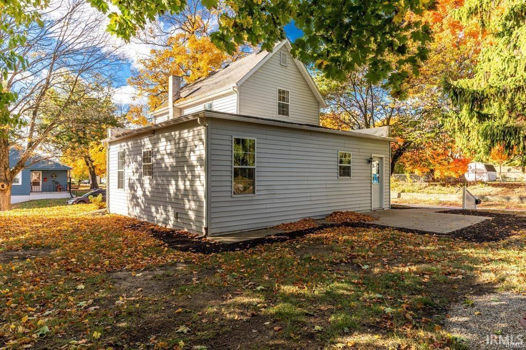 View of side of home with a patio area