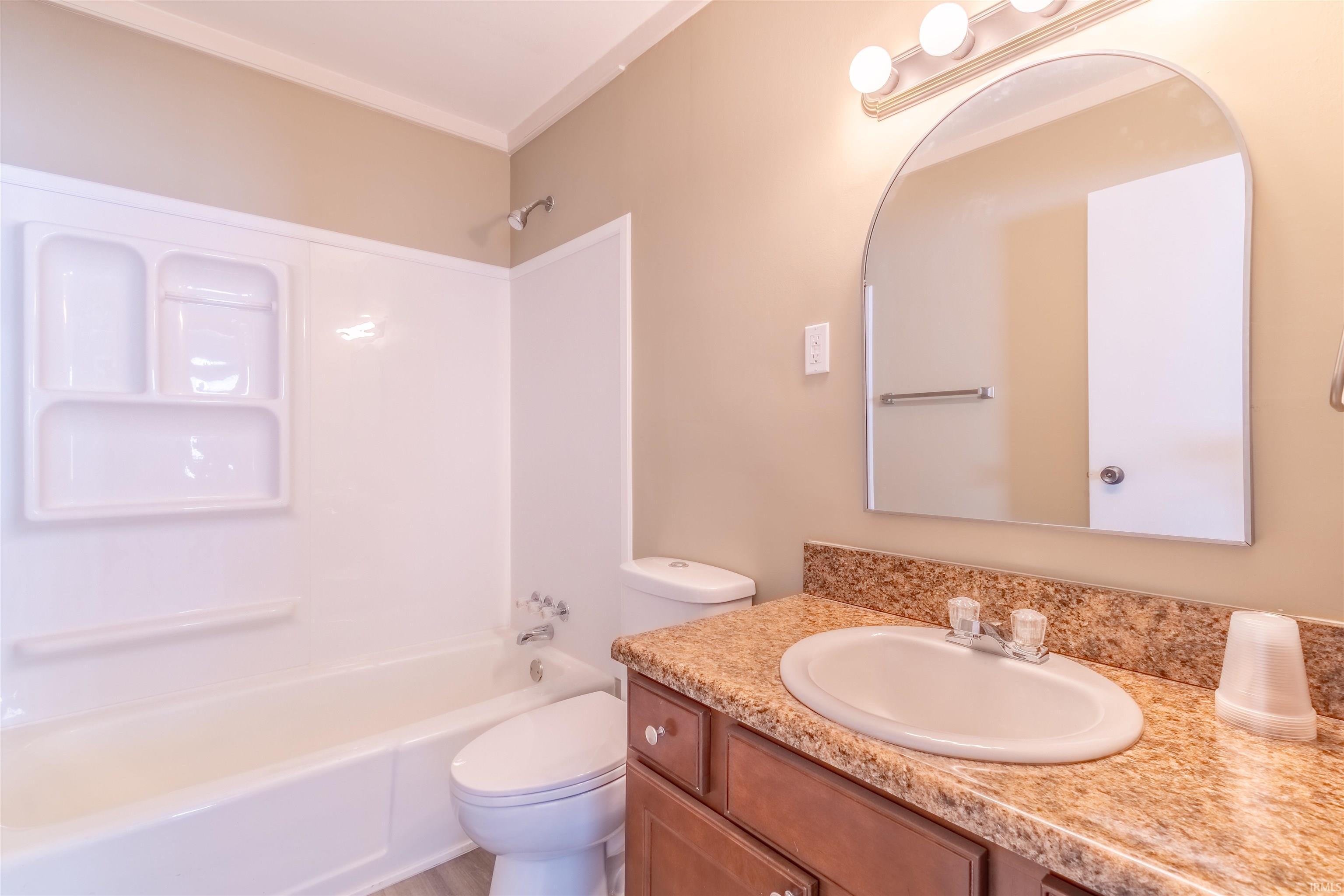 Bathroom with vanity and shower / bathtub combination