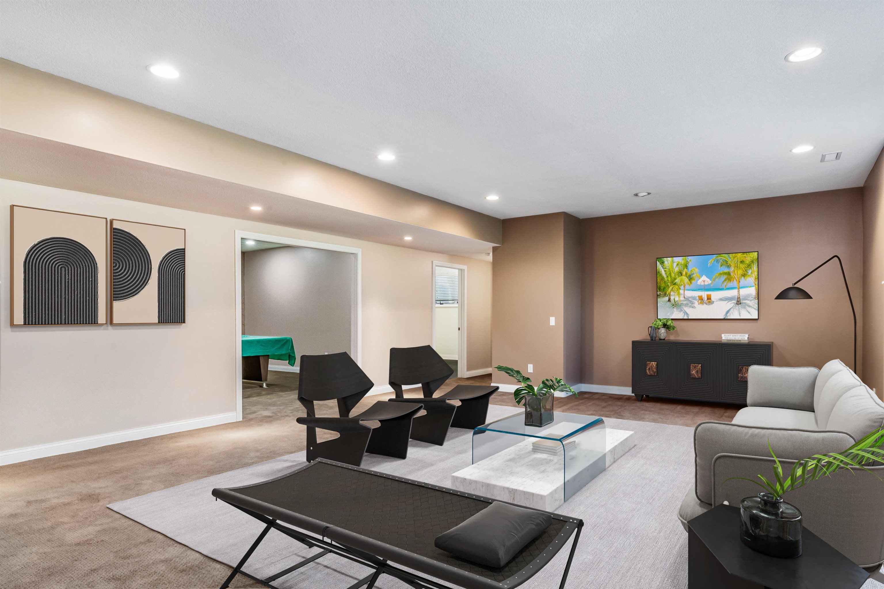 Living area with recessed lighting and light colored carpet