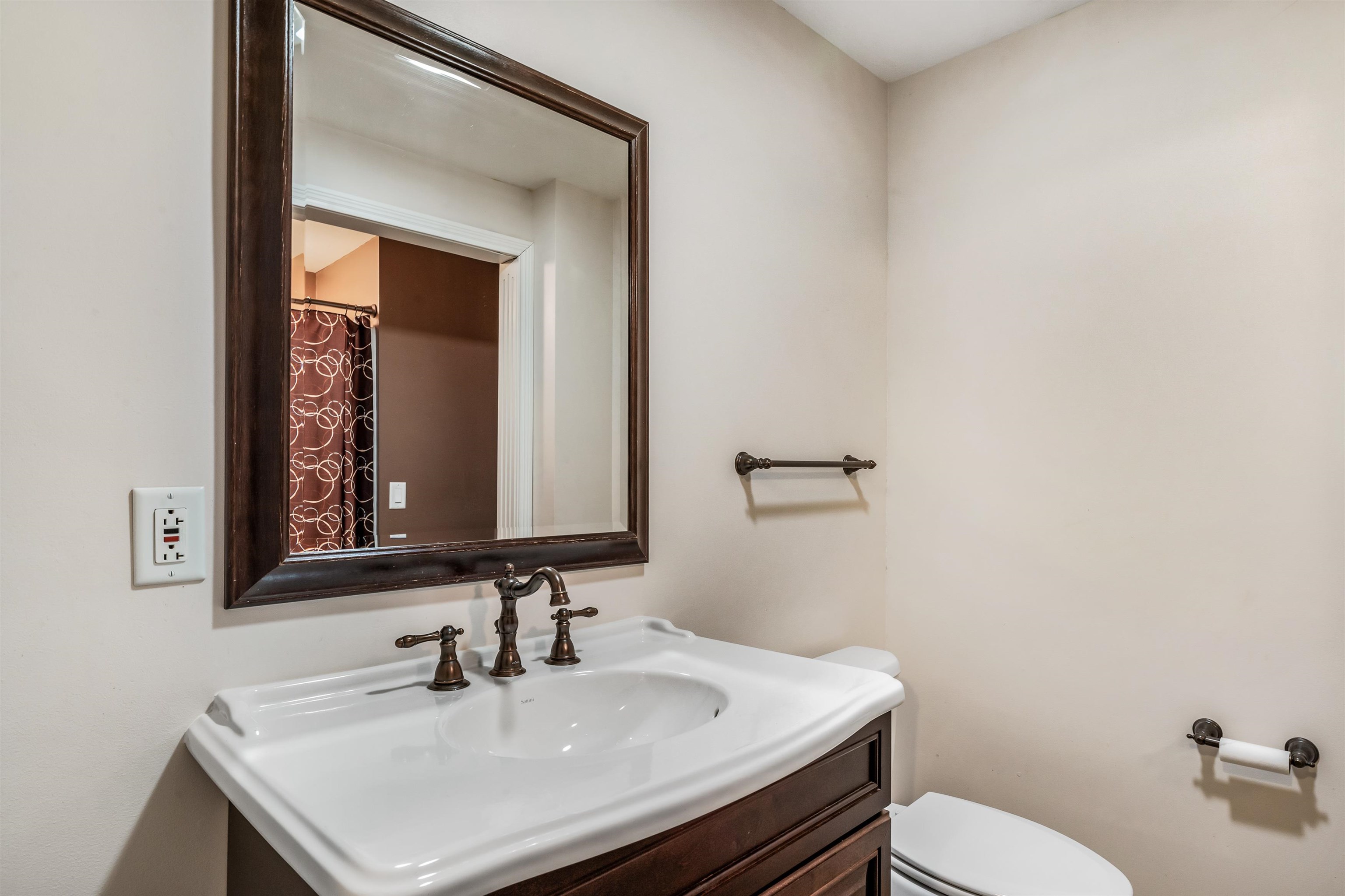 Full bathroom featuring vanity and a shower with curtain