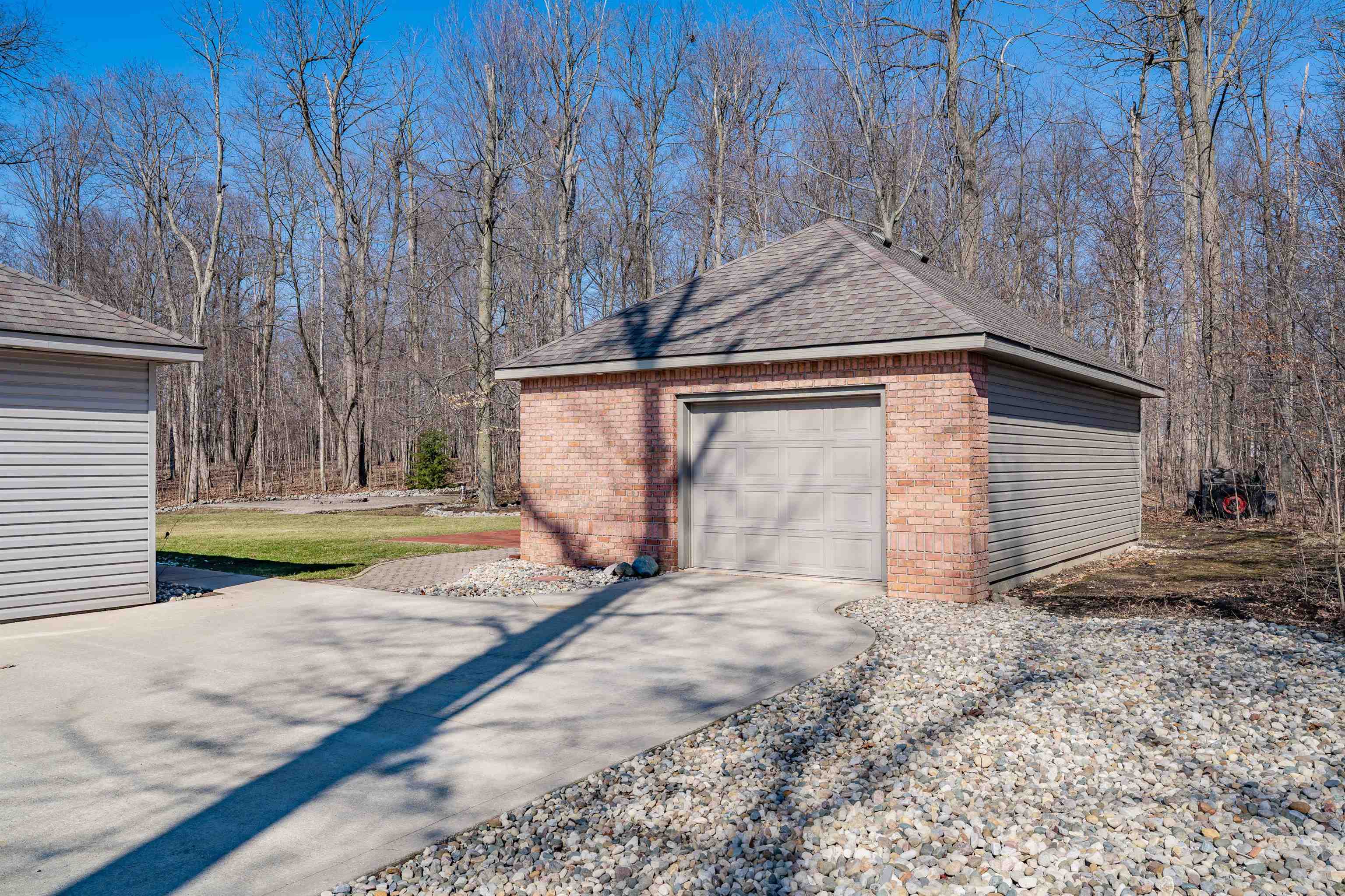 Detached garage with concrete driveway