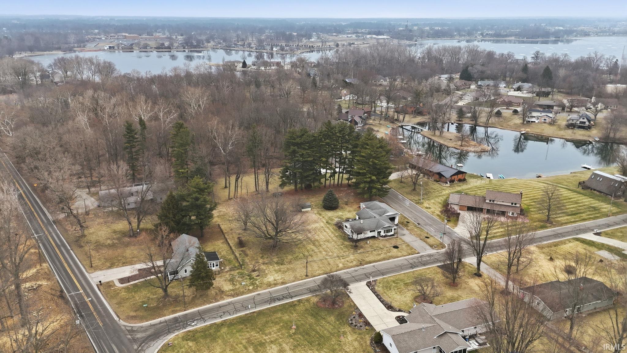 View of property location with nearby suburban area