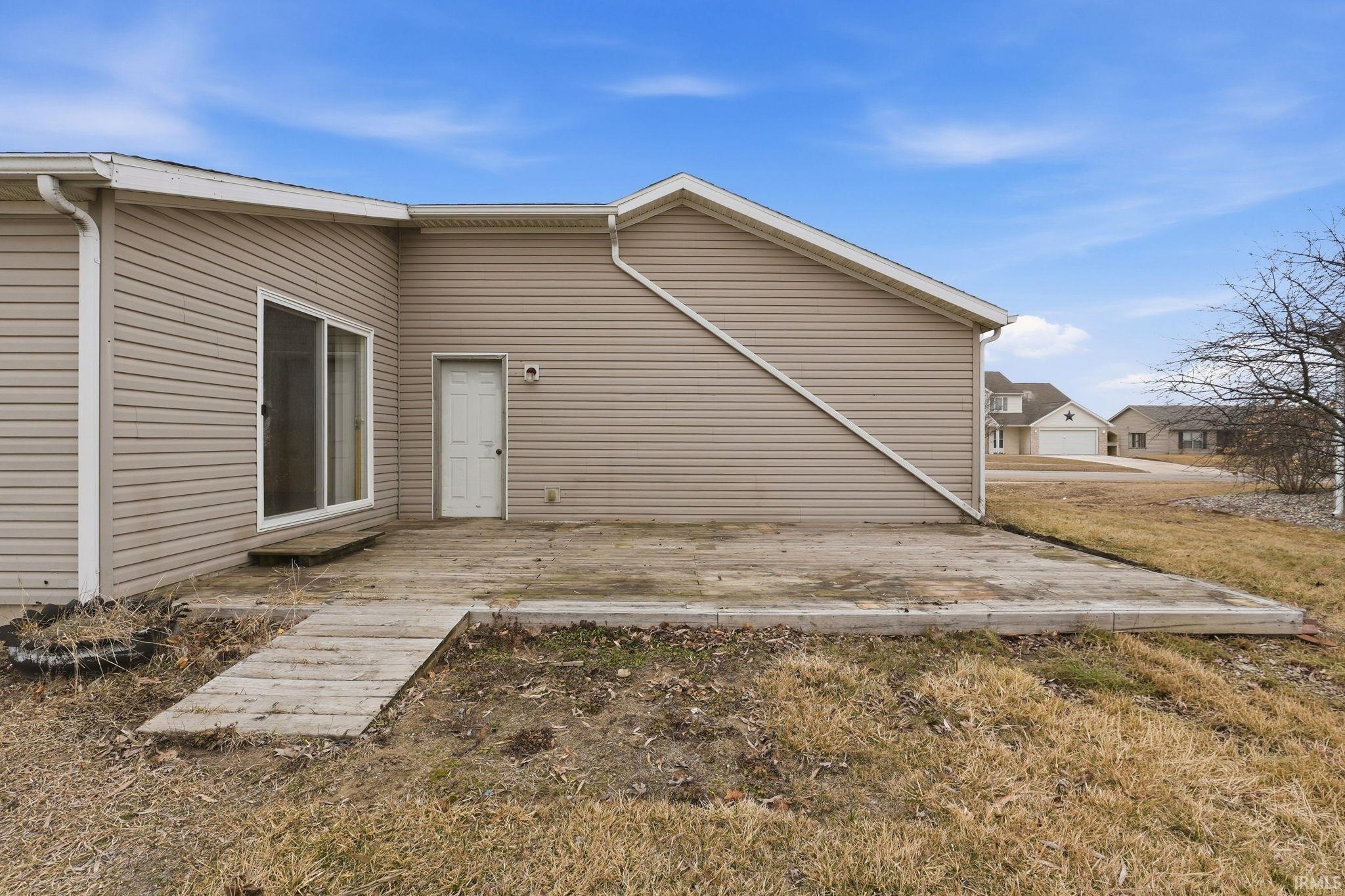 Rear view of property with a deck