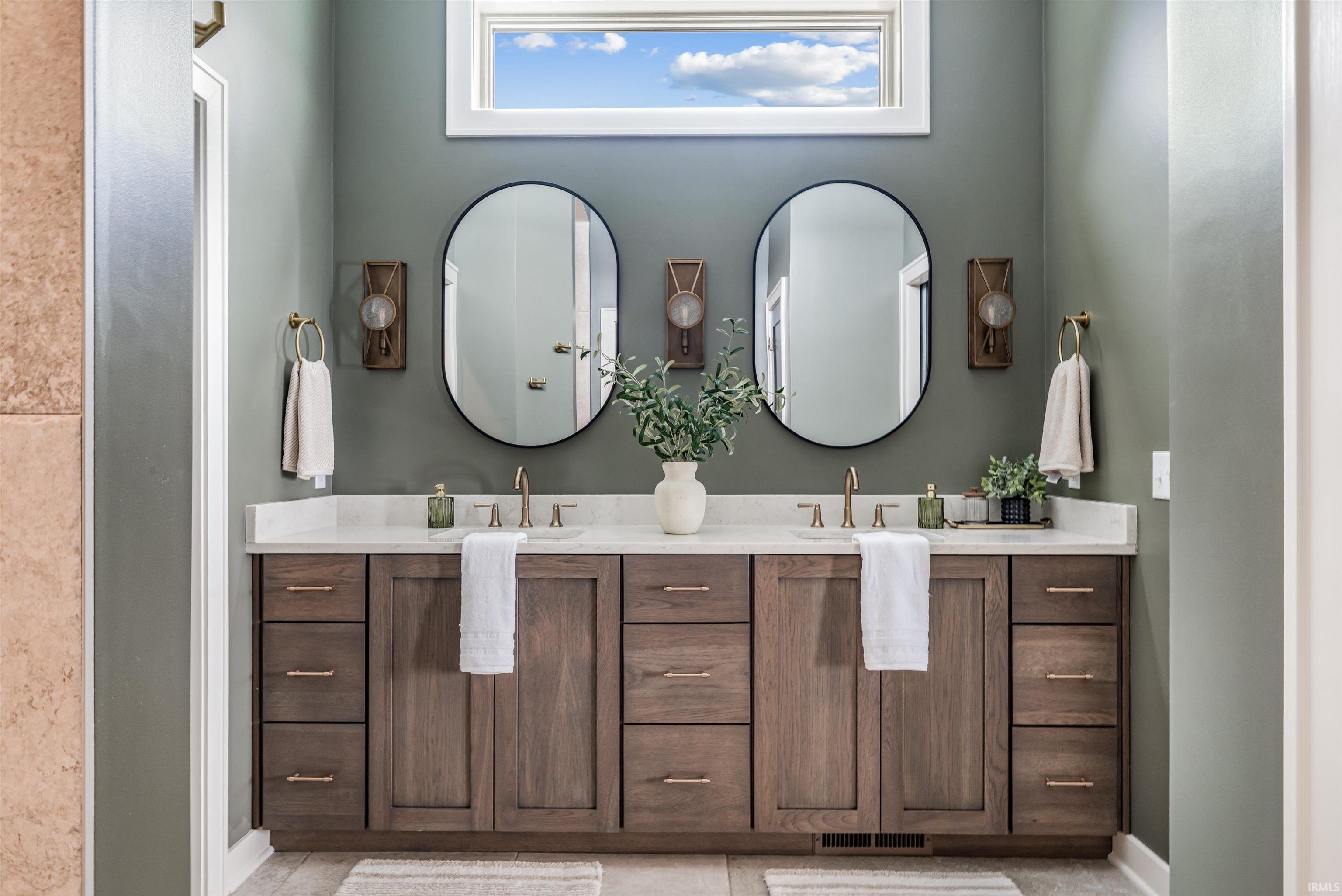 Bathroom featuring double vanity