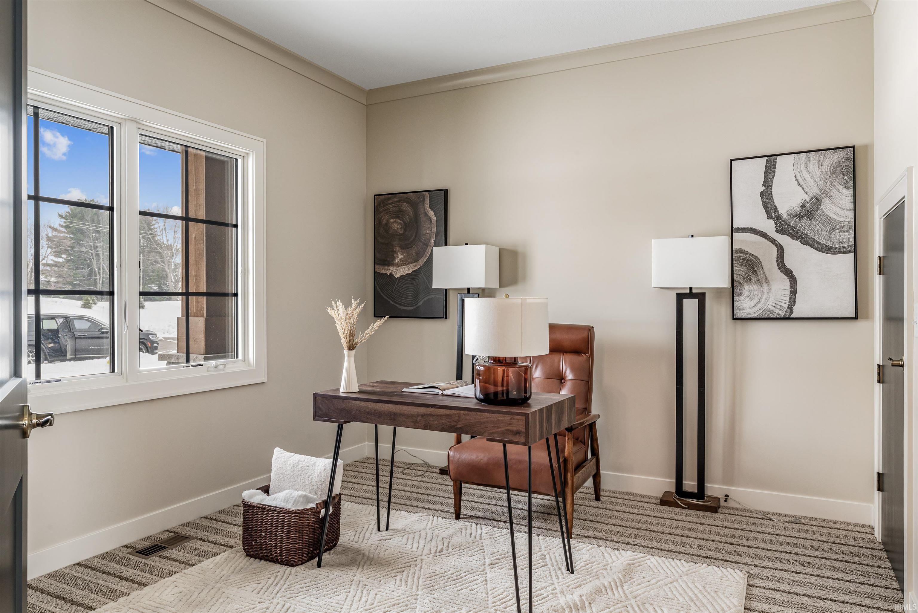 Office with baseboards and ornamental molding