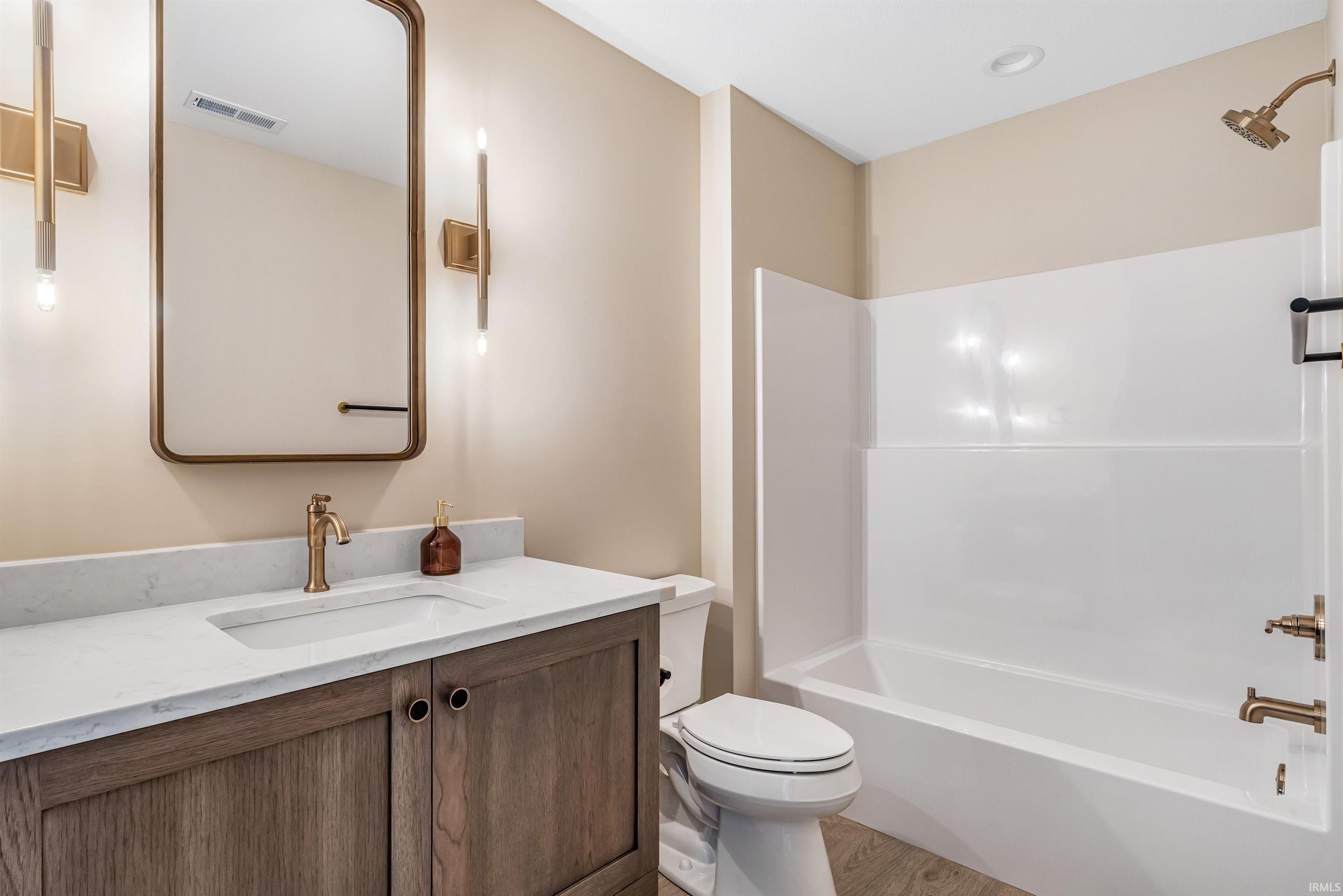 Bathroom with vanity and shower / bathtub combination
