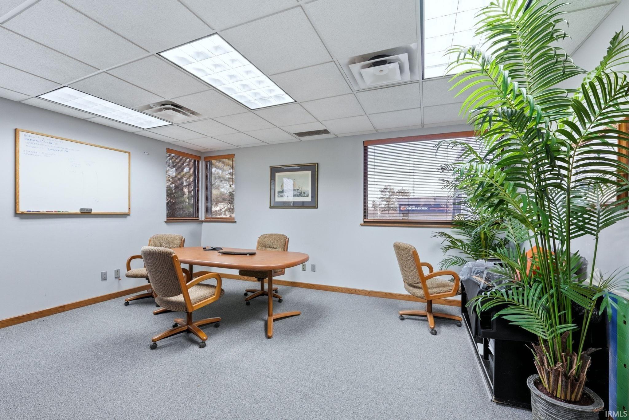 Home office featuring a drop ceiling