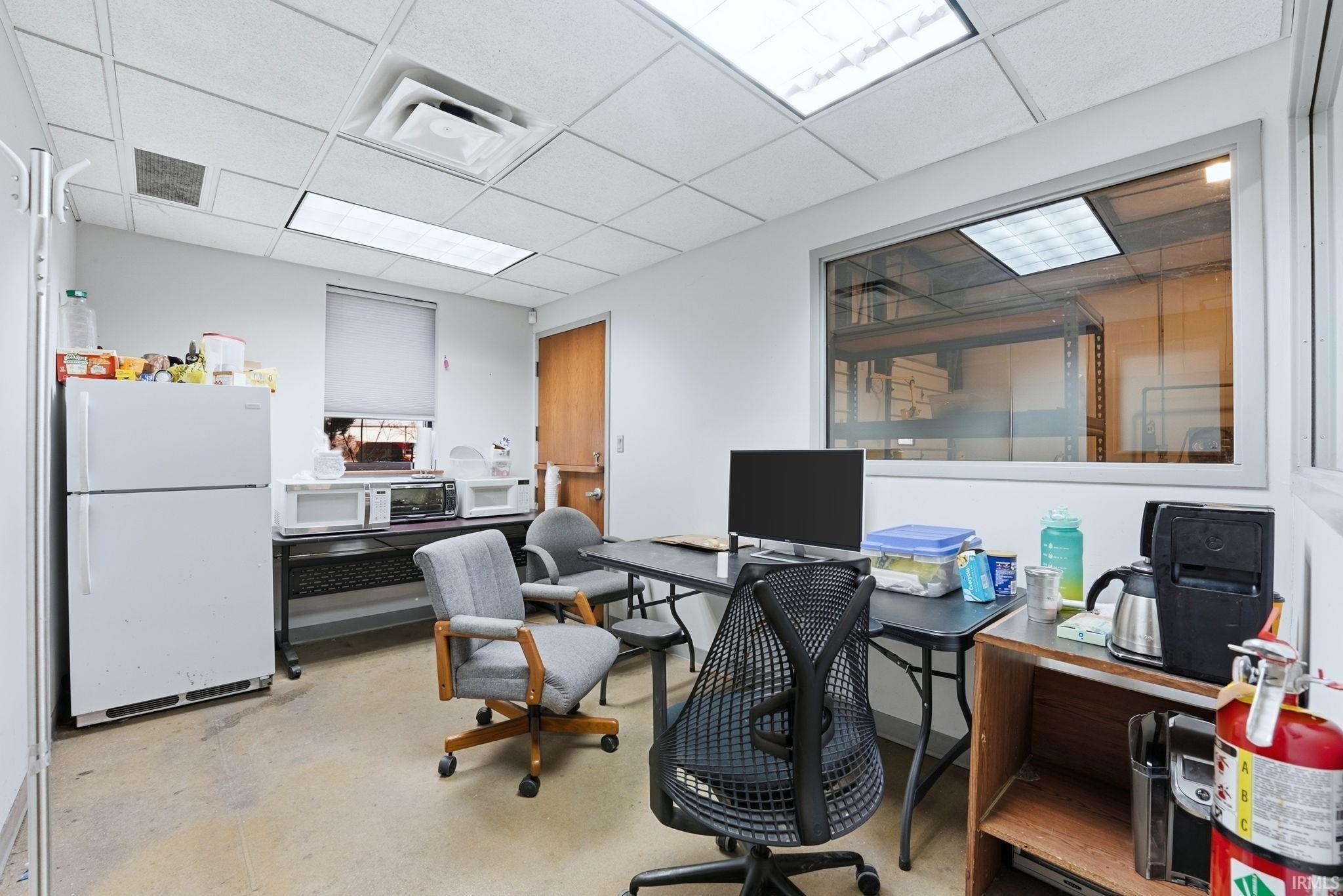 Office area featuring a drop ceiling