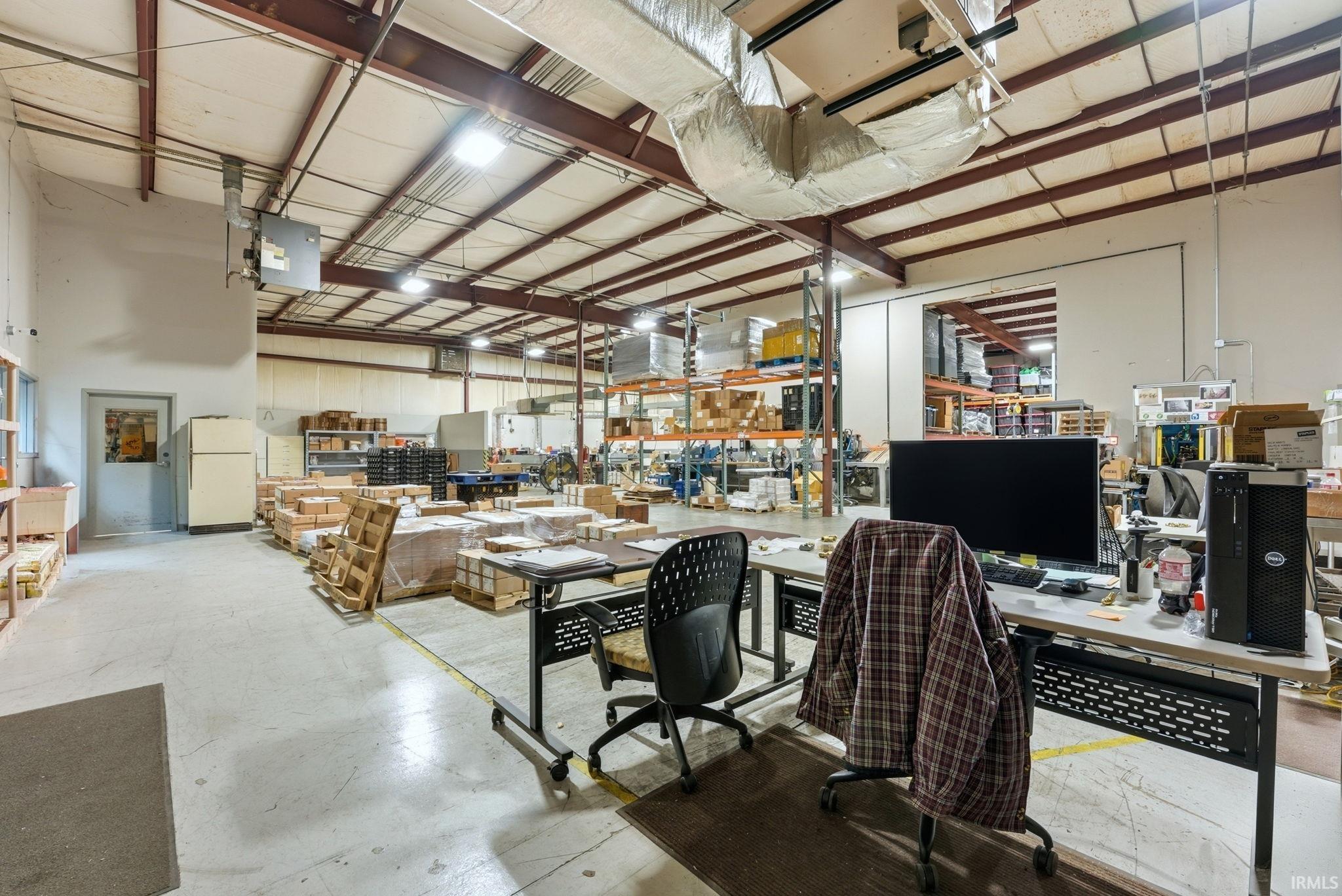 Office featuring a heating unit and a workshop area
