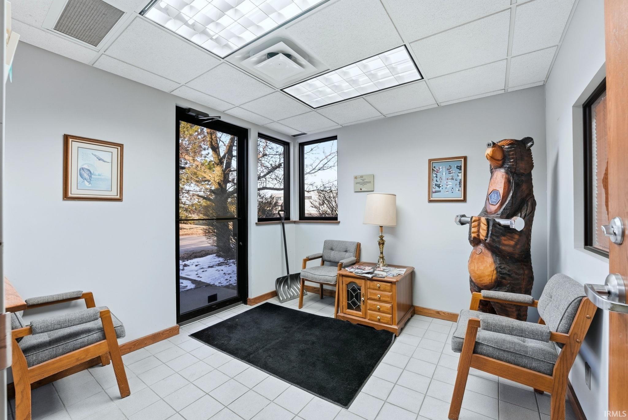 Office area featuring a paneled ceiling