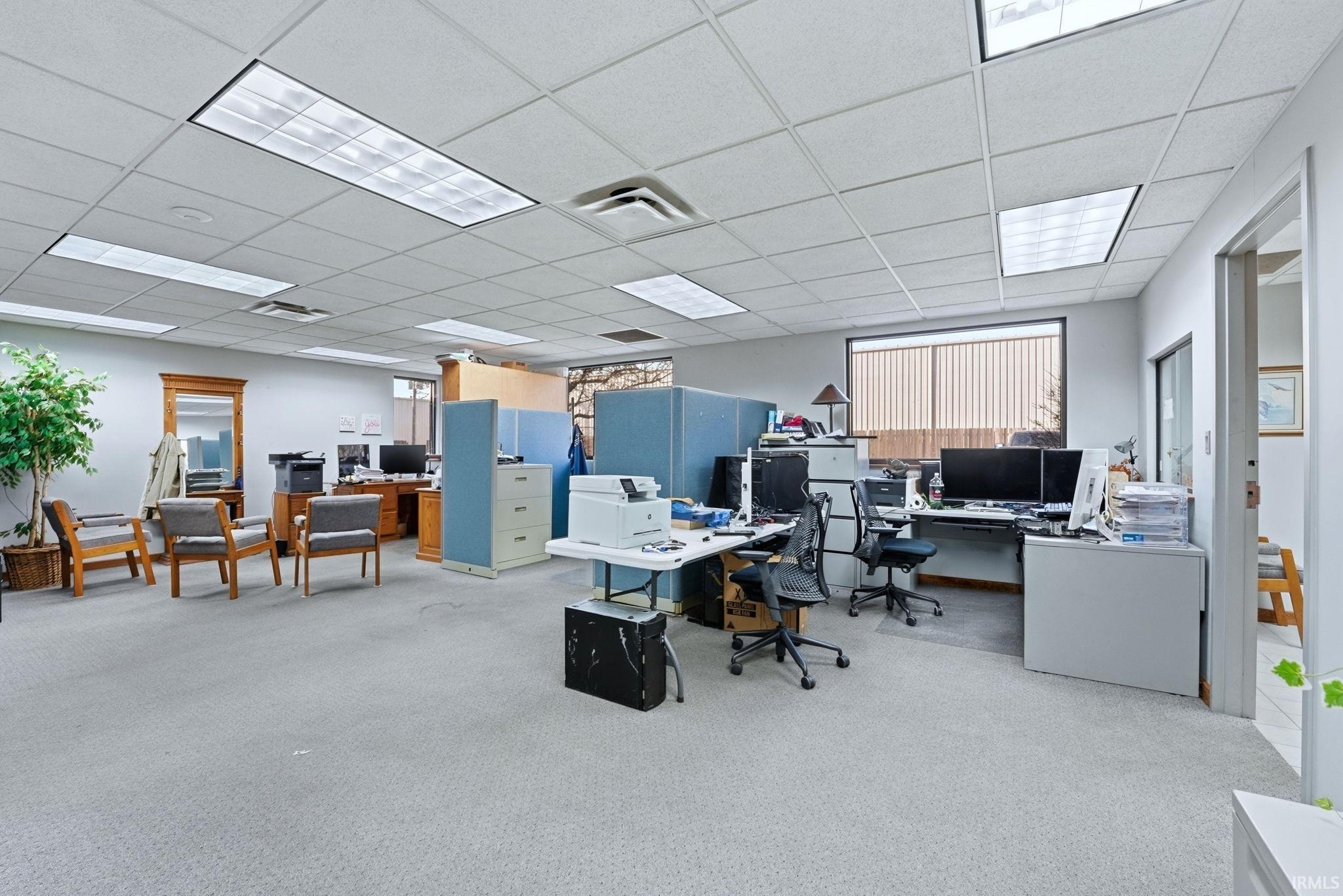 Office space featuring a drop ceiling