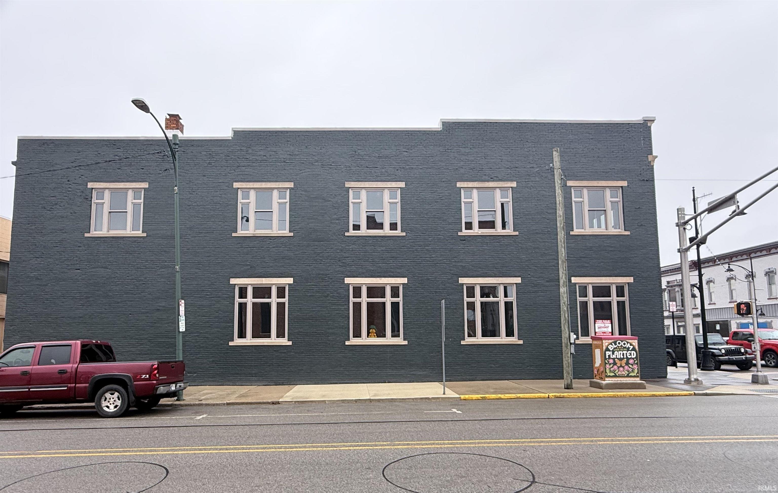 View of front of house featuring brick siding