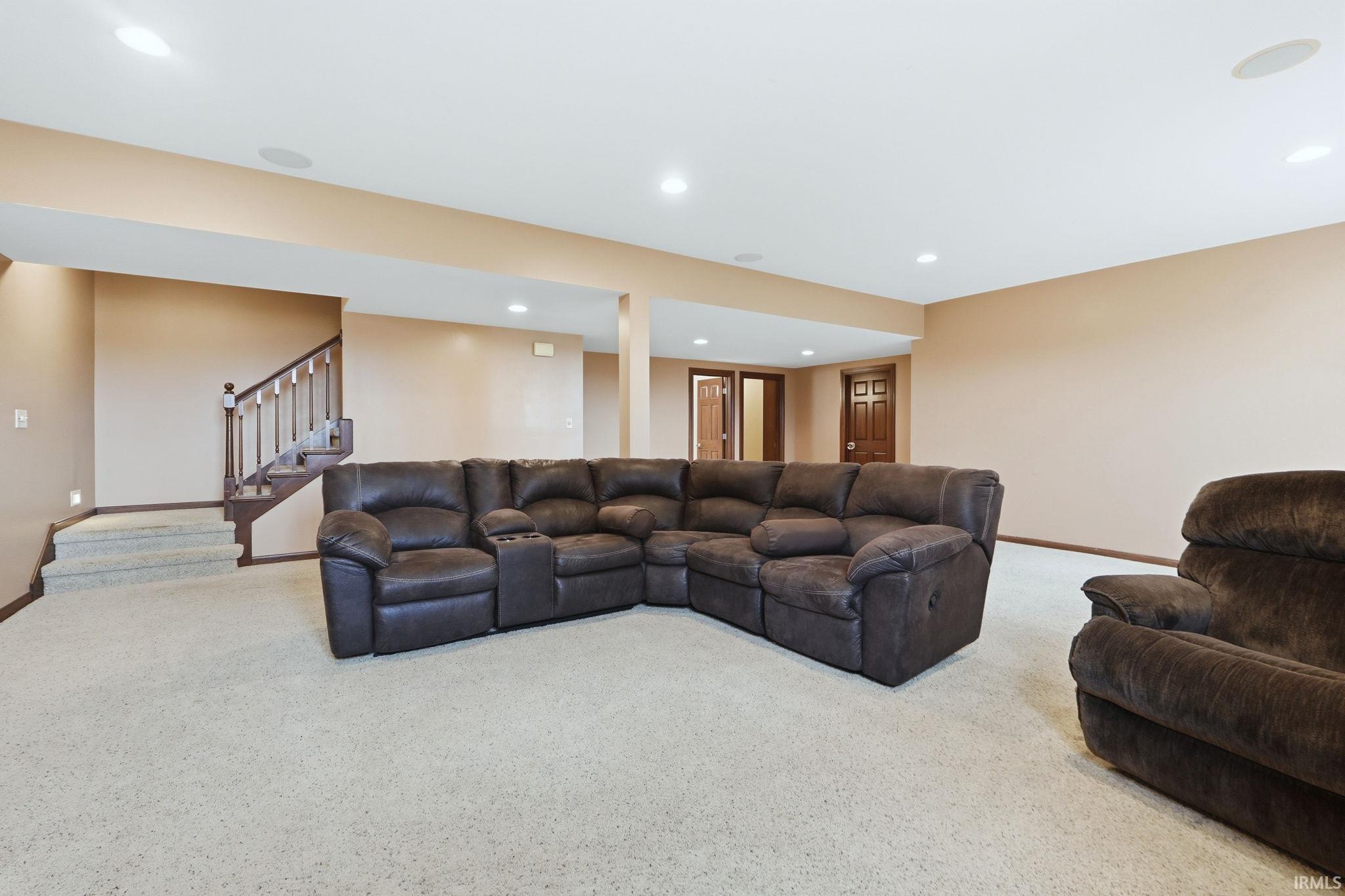 Living room featuring carpet floors and recessed lighting