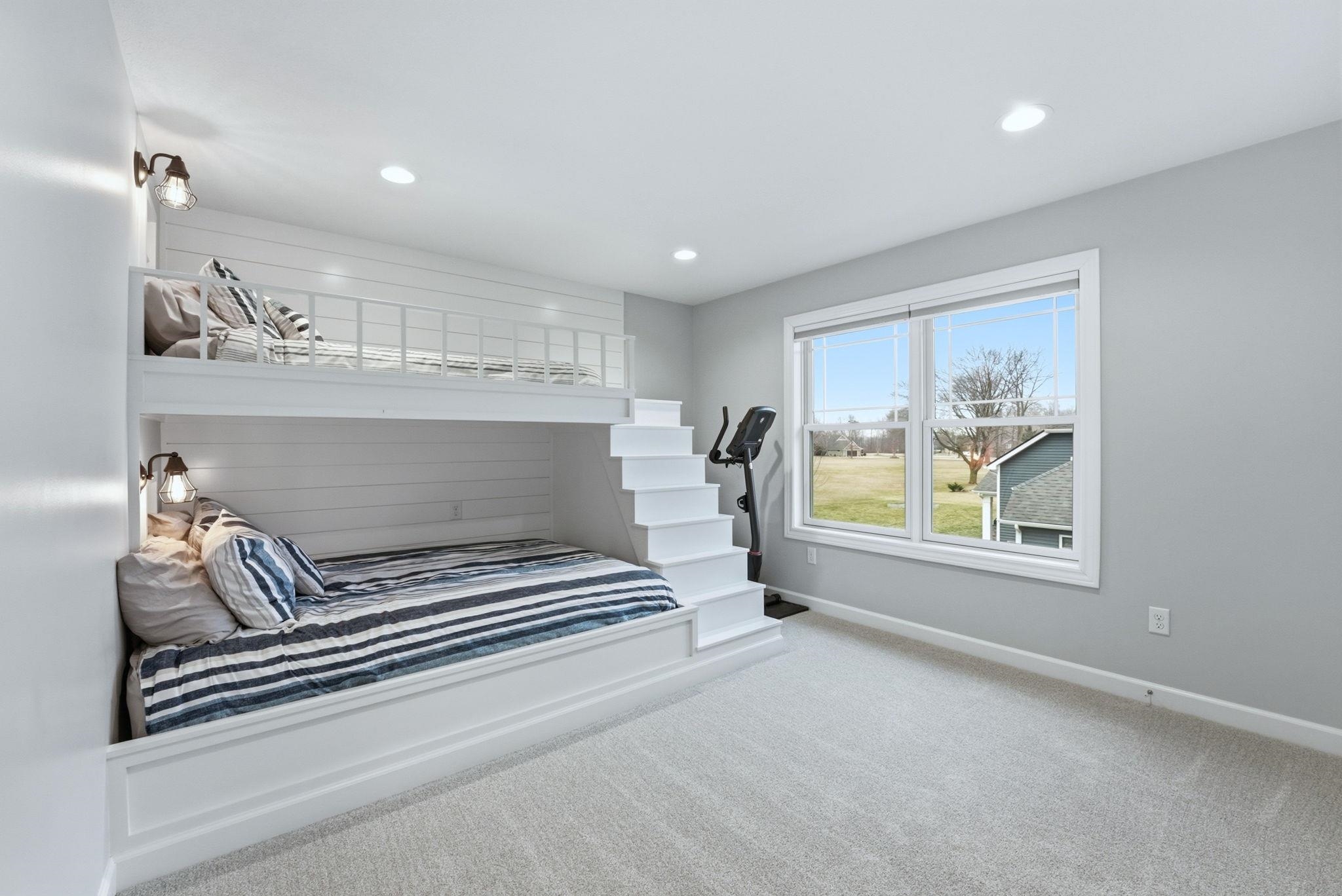 Bedroom with light carpet and recessed lighting