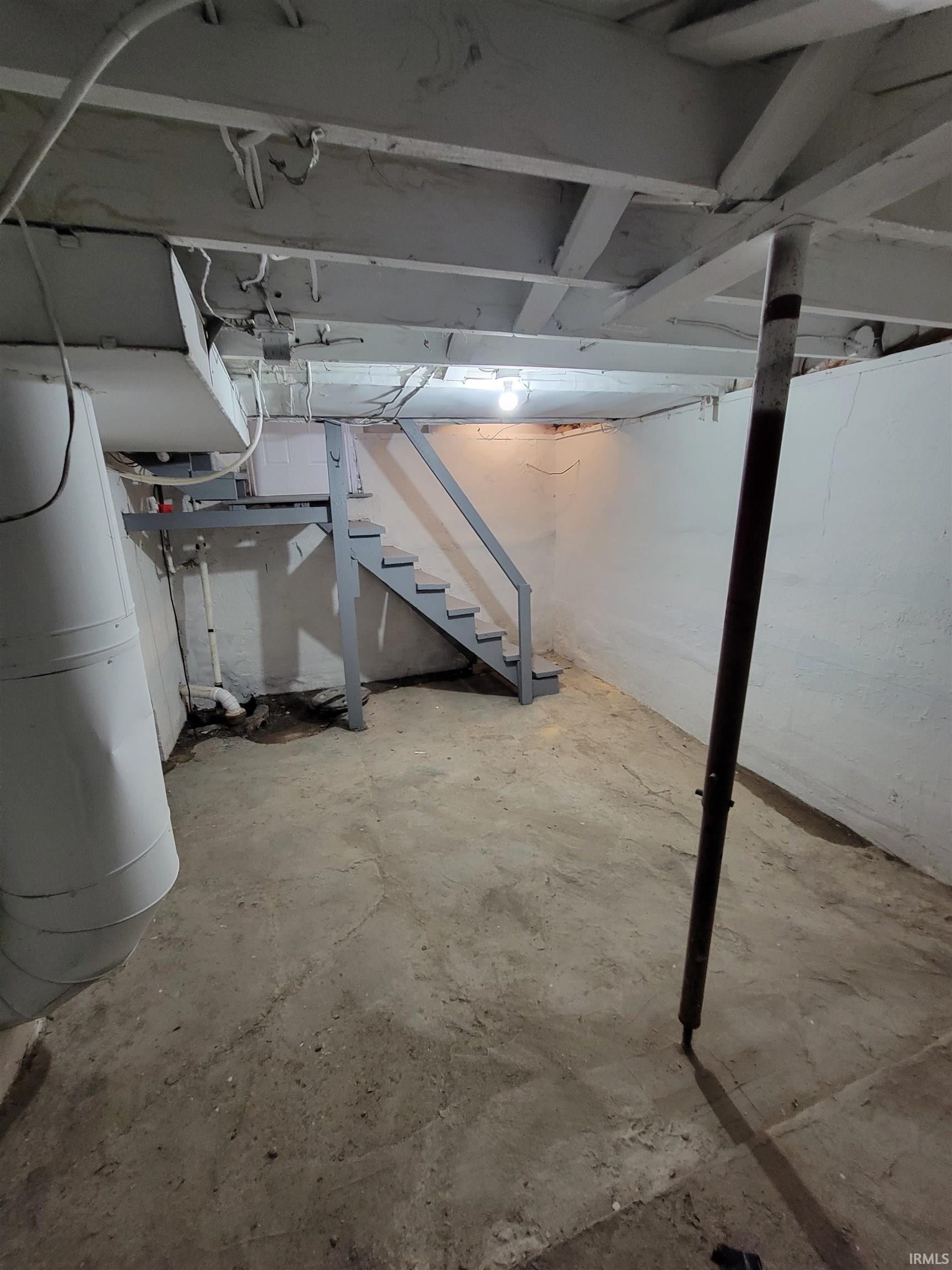 Unfinished basement with stairway