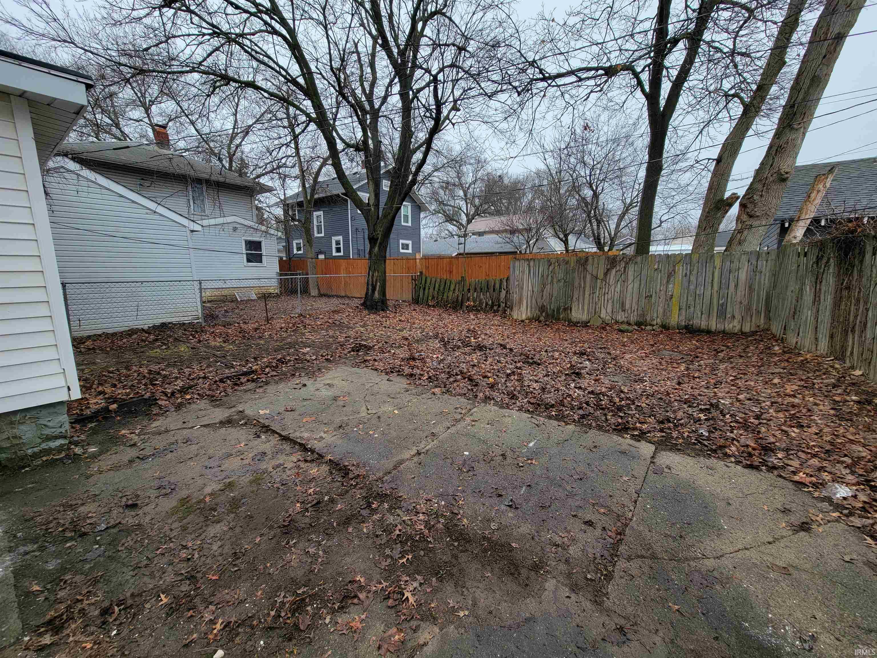 Fenced backyard with a patio